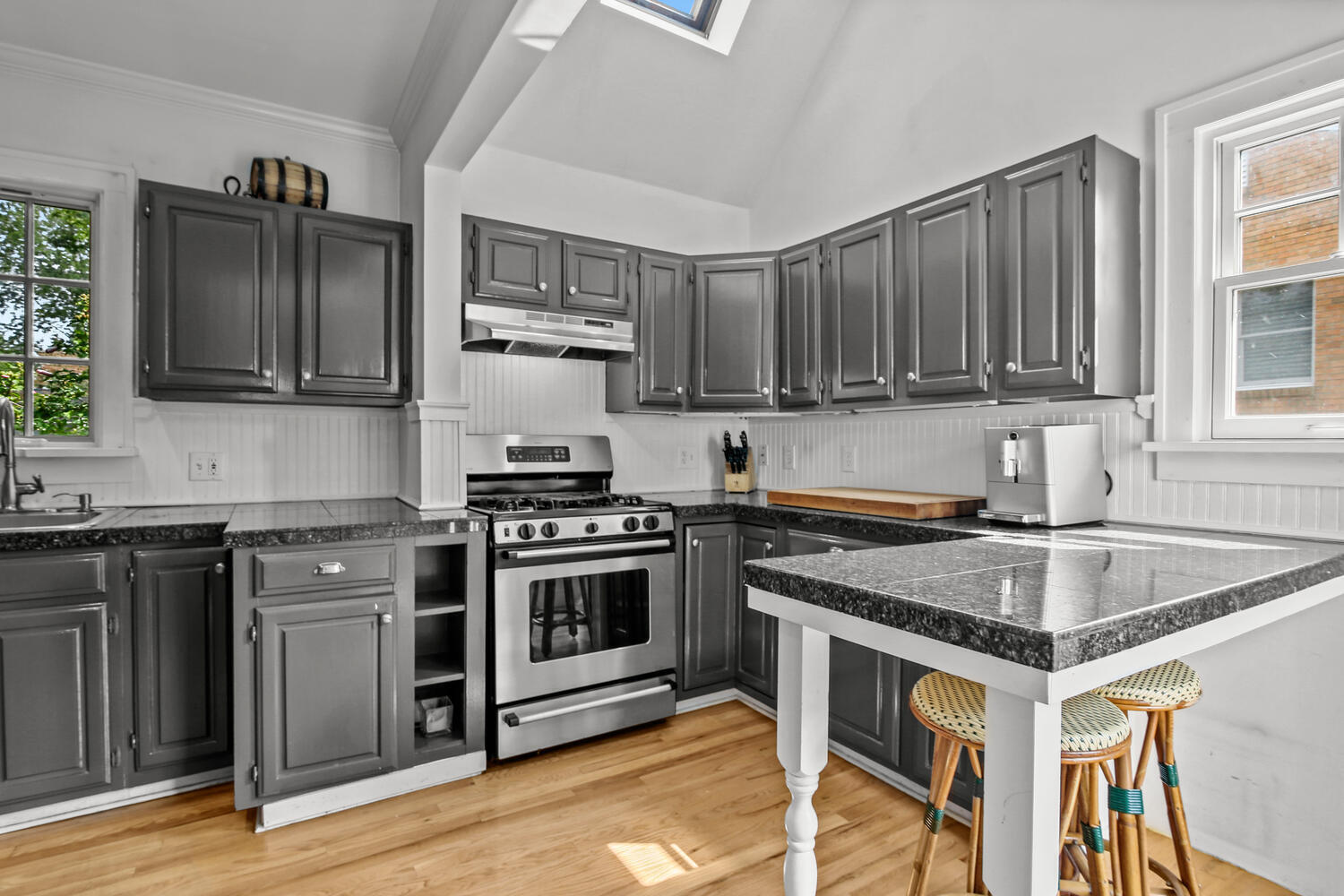 25 Butler Street Greenwich, CT 06807 - Photo 13 of 37 a kitchen with a stove a sink and a microwave