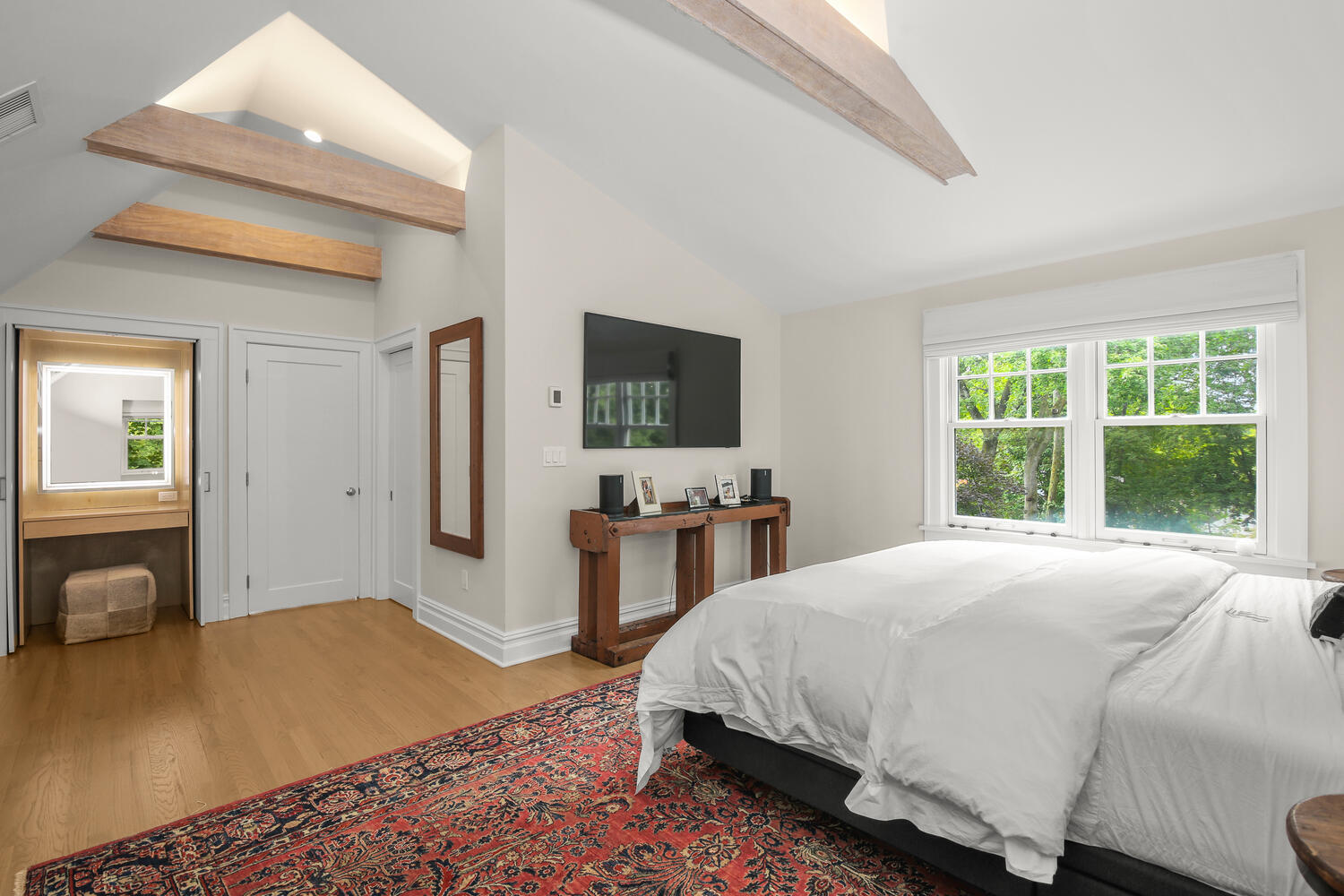 25 Butler Street Greenwich, CT 06807 - Photo 19 of 37 a bedroom with a bed and wooden floor