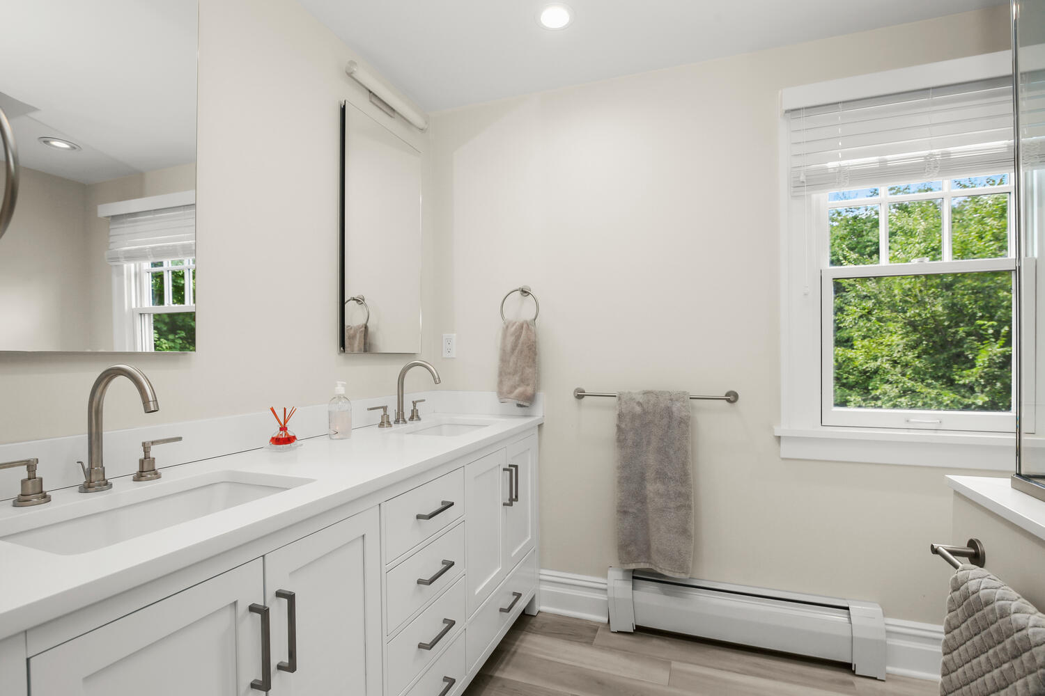 25 Butler Street Greenwich, CT 06807 - Photo 24 of 37 a bathroom with a double vanity sink window and a mirror