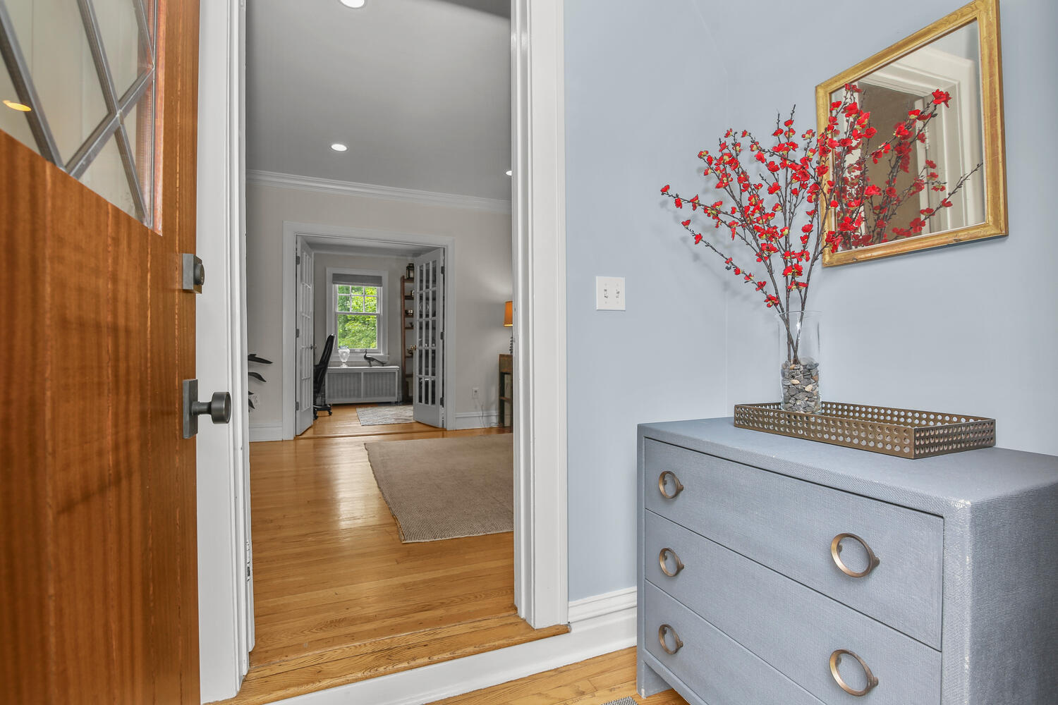 25 Butler Street Greenwich, CT 06807 - Photo 3 of 37 a view of a hallway to a livingroom with furniture