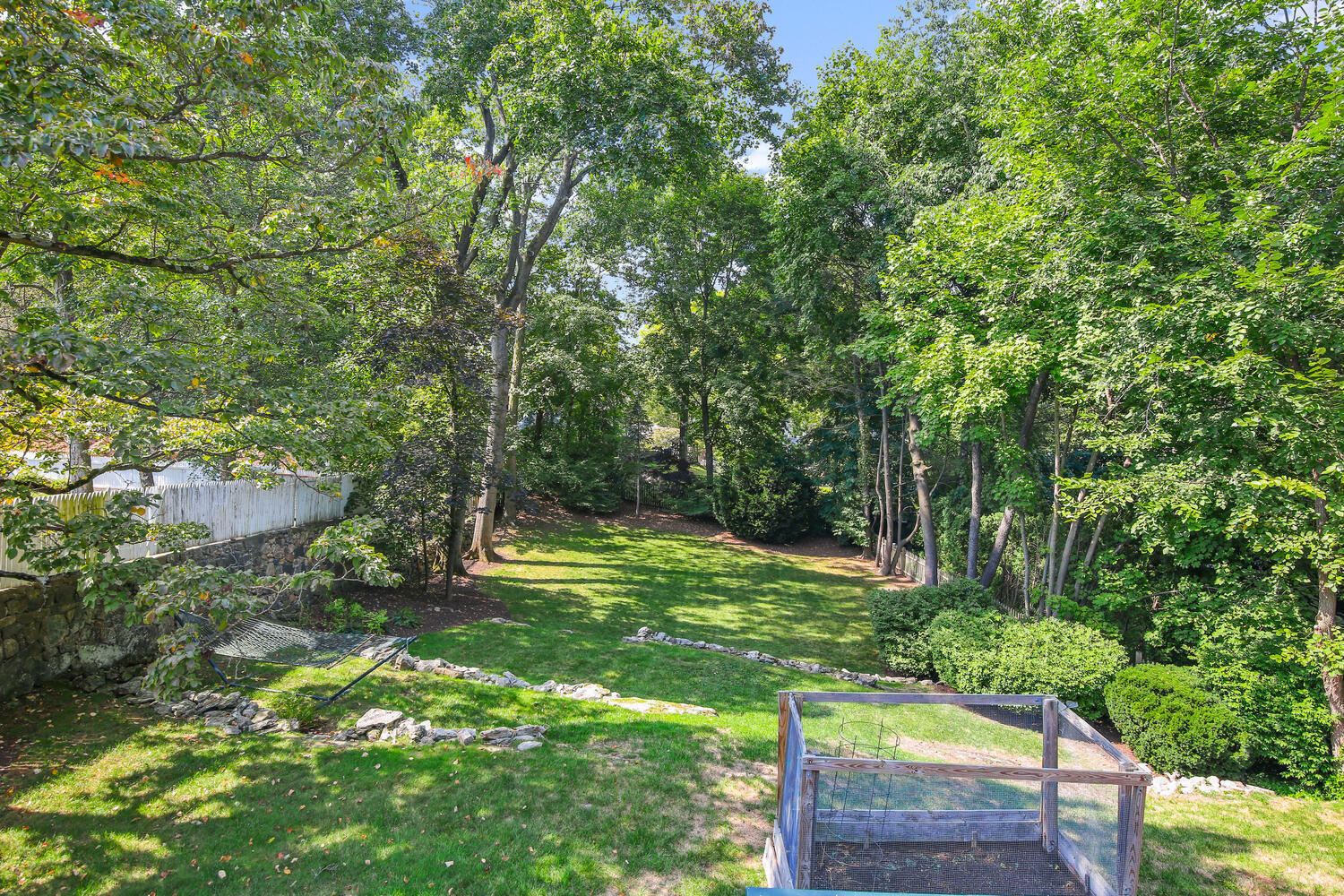 25 Butler Street Greenwich, CT 06807 - Photo 33 of 37 a backyard of a house with lots of green space