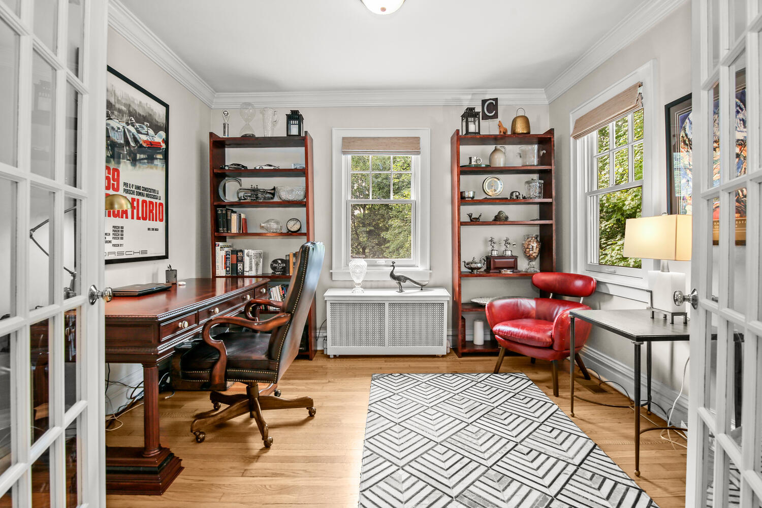 25 Butler Street Greenwich, CT 06807 - Photo 8 of 37 a workspace with furniture and a book shelf