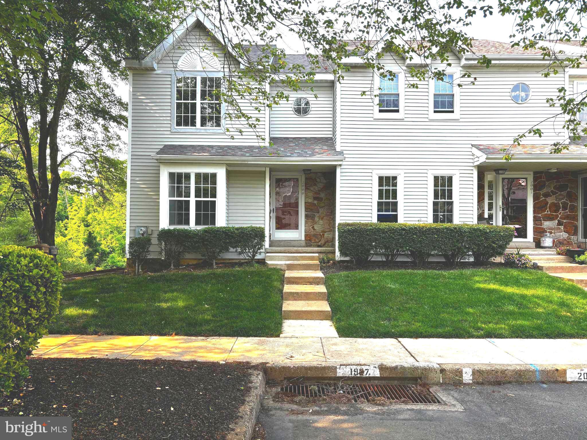 2000 Red Maple Grove Ambler, PA 19002 - Photo 1 of 1 a front view of a house with a yard and garage