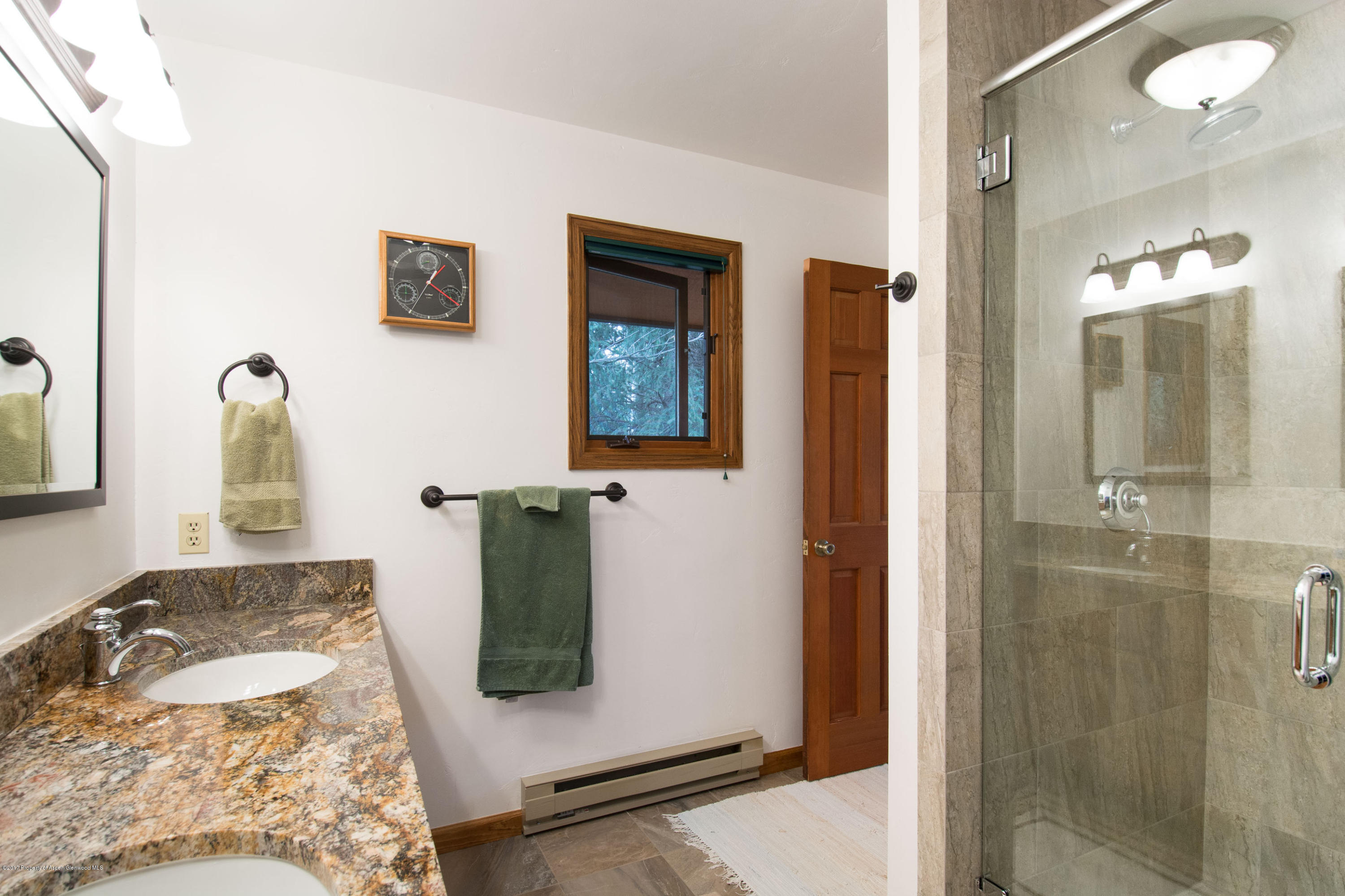 144 Haystack Lane Snowmass, CO 81654 - Photo 11 of 40 a bathroom with a sink and a mirror