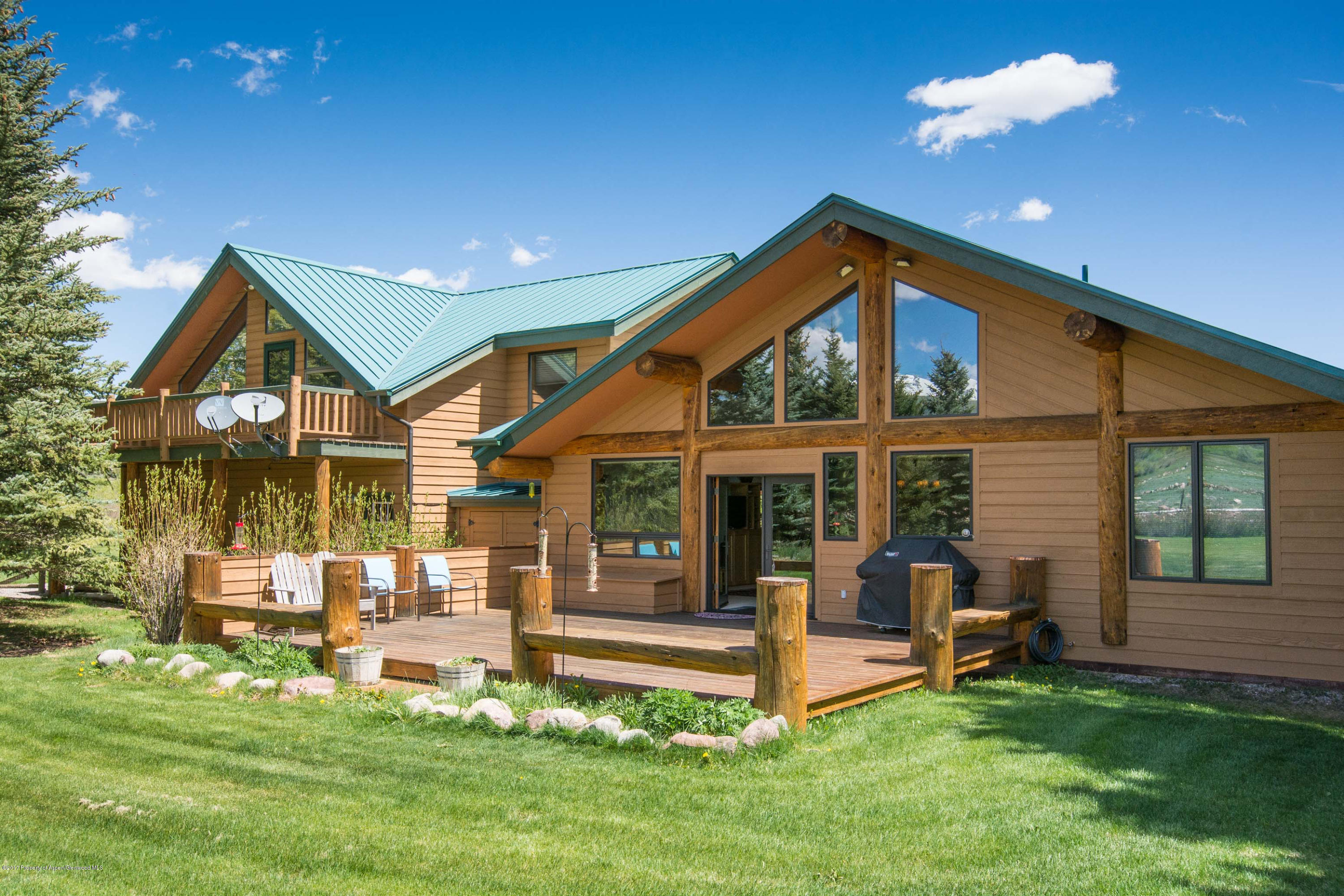 144 Haystack Lane Snowmass, CO 81654 - Photo 16 of 40 a view of a house with a yard porch and sitting area