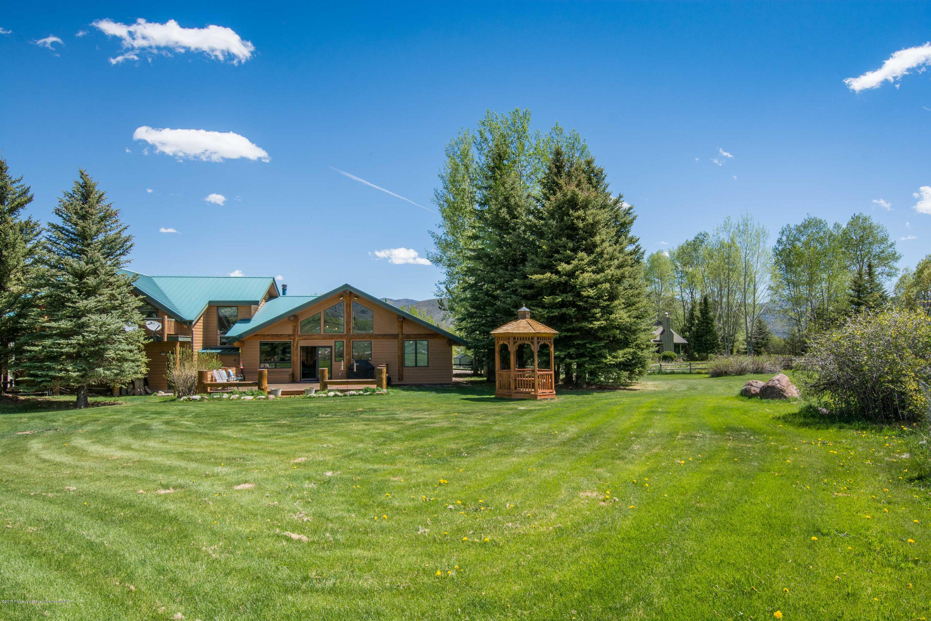 144 Haystack Lane Snowmass, CO 81654 - Photo 17 of 40 a view of a house with a yard