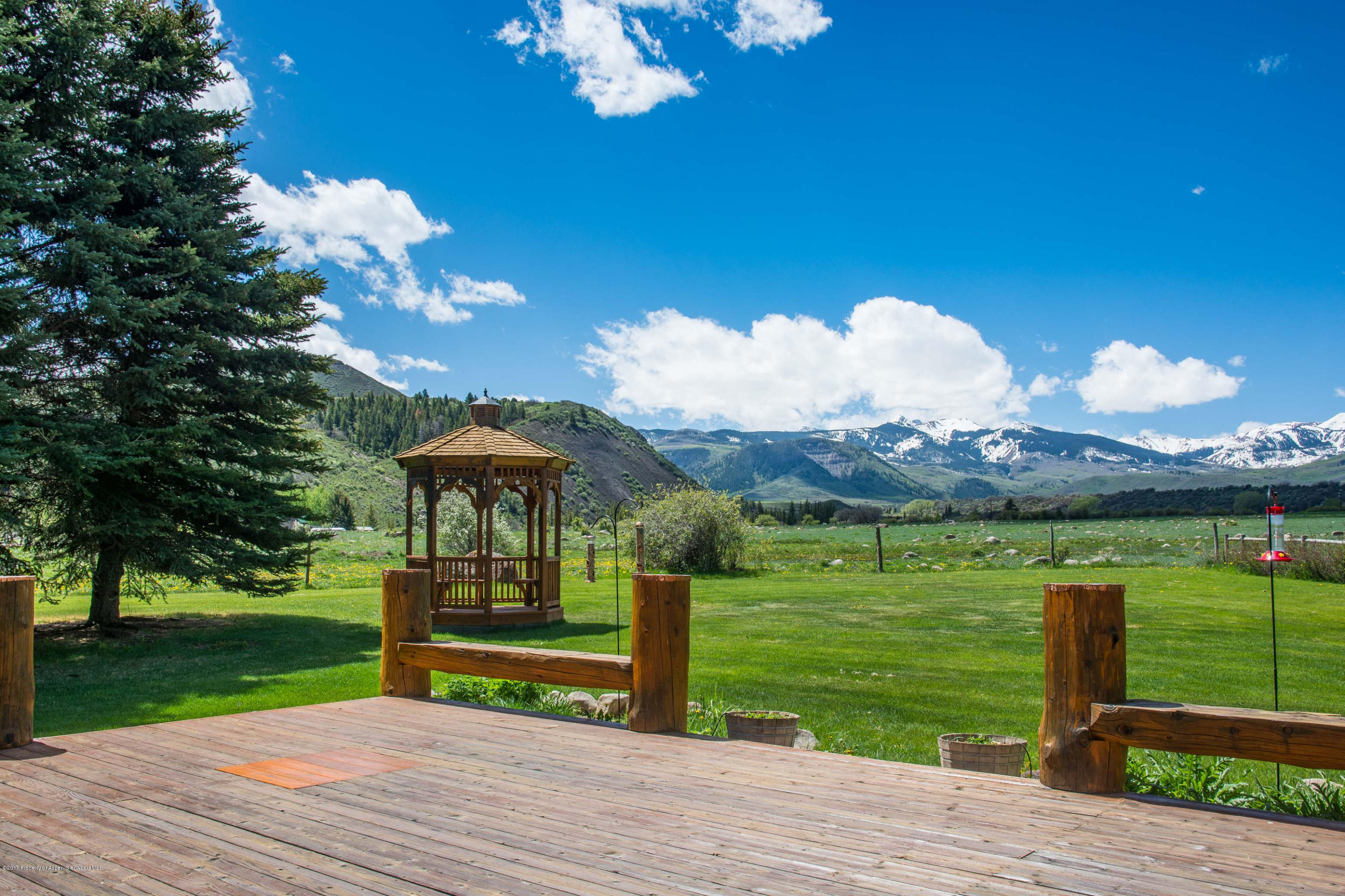 144 Haystack Lane Snowmass, CO 81654 - Photo 18 of 40 a view of a house with a yard