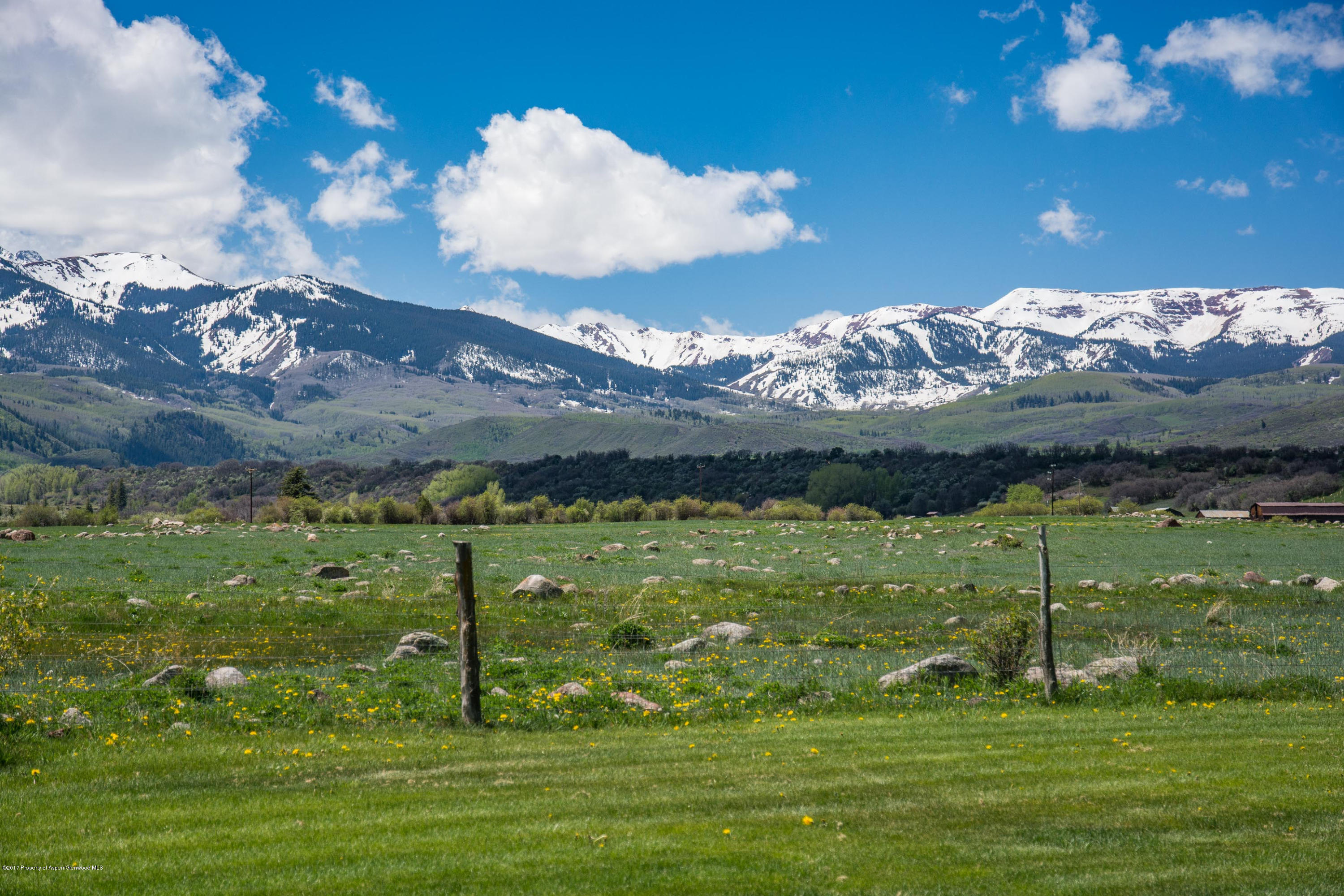 144 Haystack Lane Snowmass, CO 81654 - Photo 22 of 40 a view of a golf course with a lake