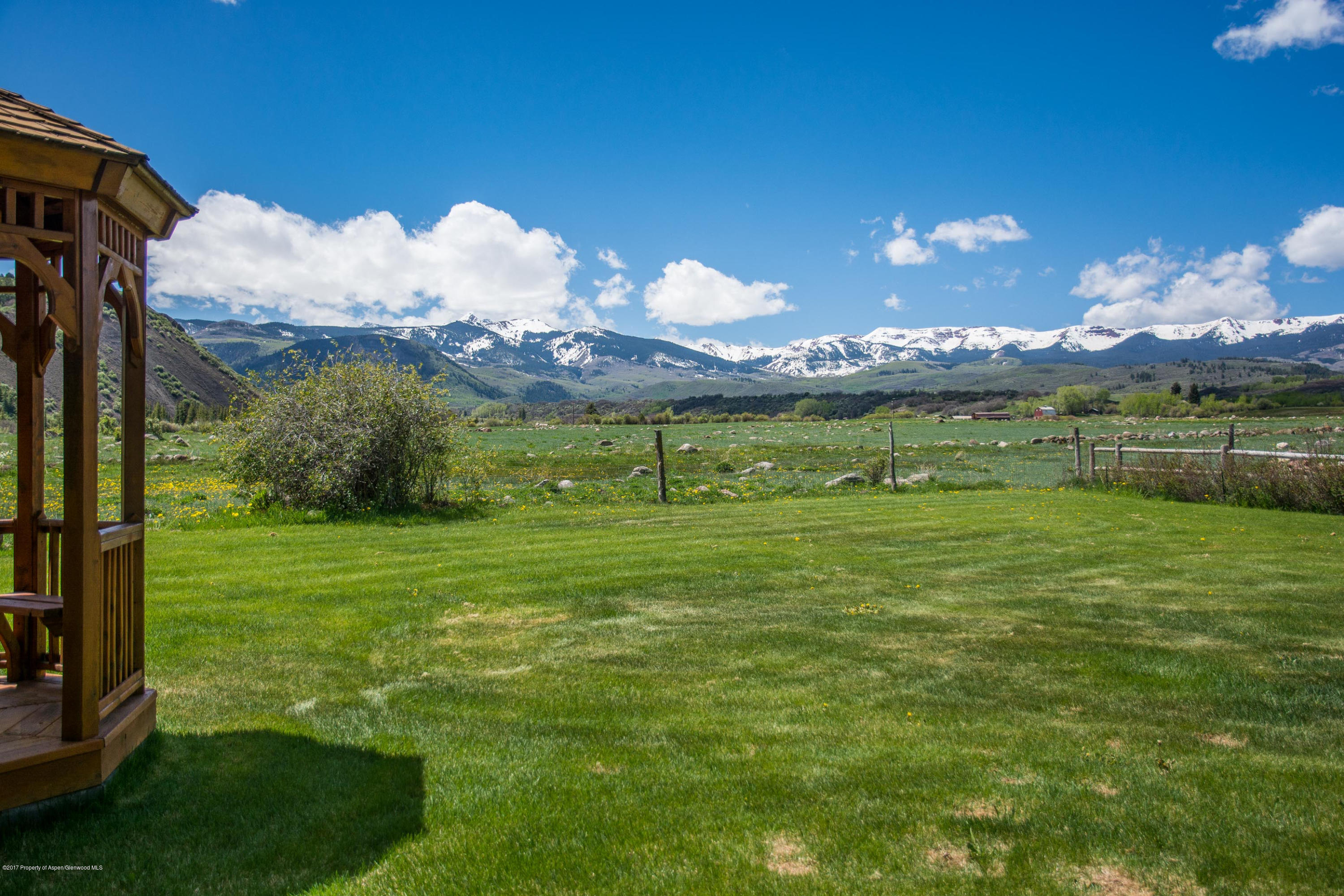 144 Haystack Lane Snowmass, CO 81654 - Photo 23 of 40 a view of a golf course with a lake