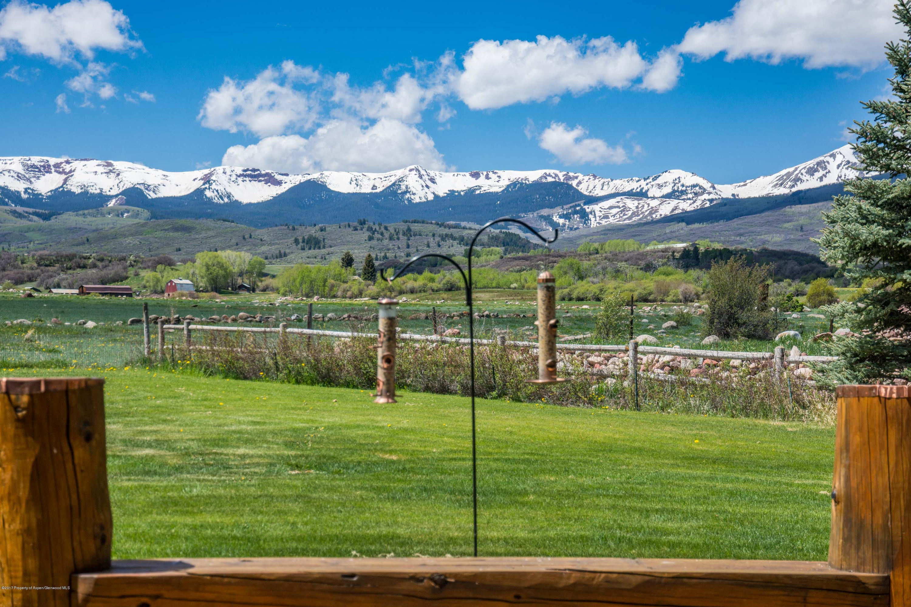144 Haystack Lane Snowmass, CO 81654 - Photo 25 of 40 a view of a golf course with a lake view