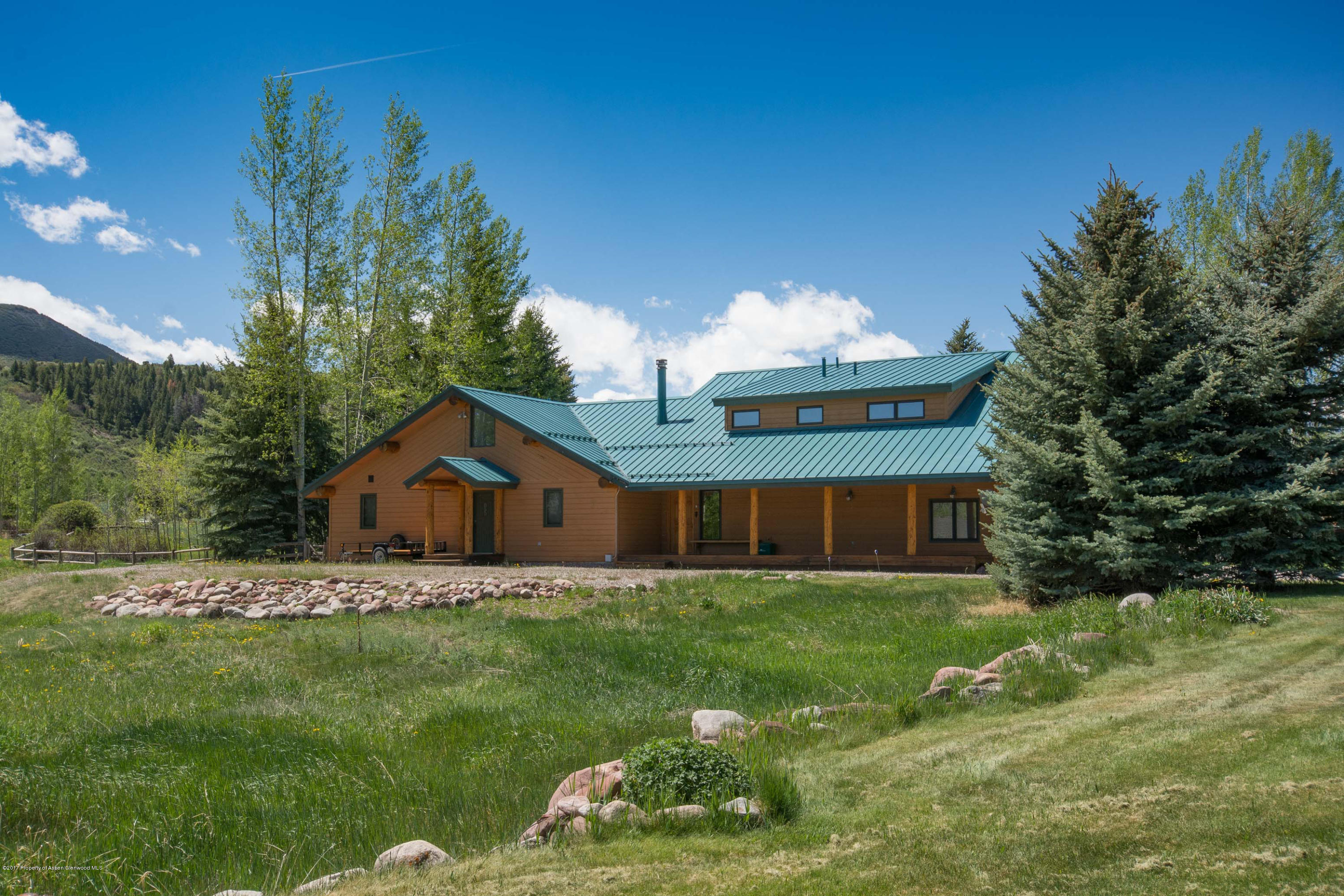 144 Haystack Lane Snowmass, CO 81654 - Photo 26 of 40 a view of a house with a yard and sitting area