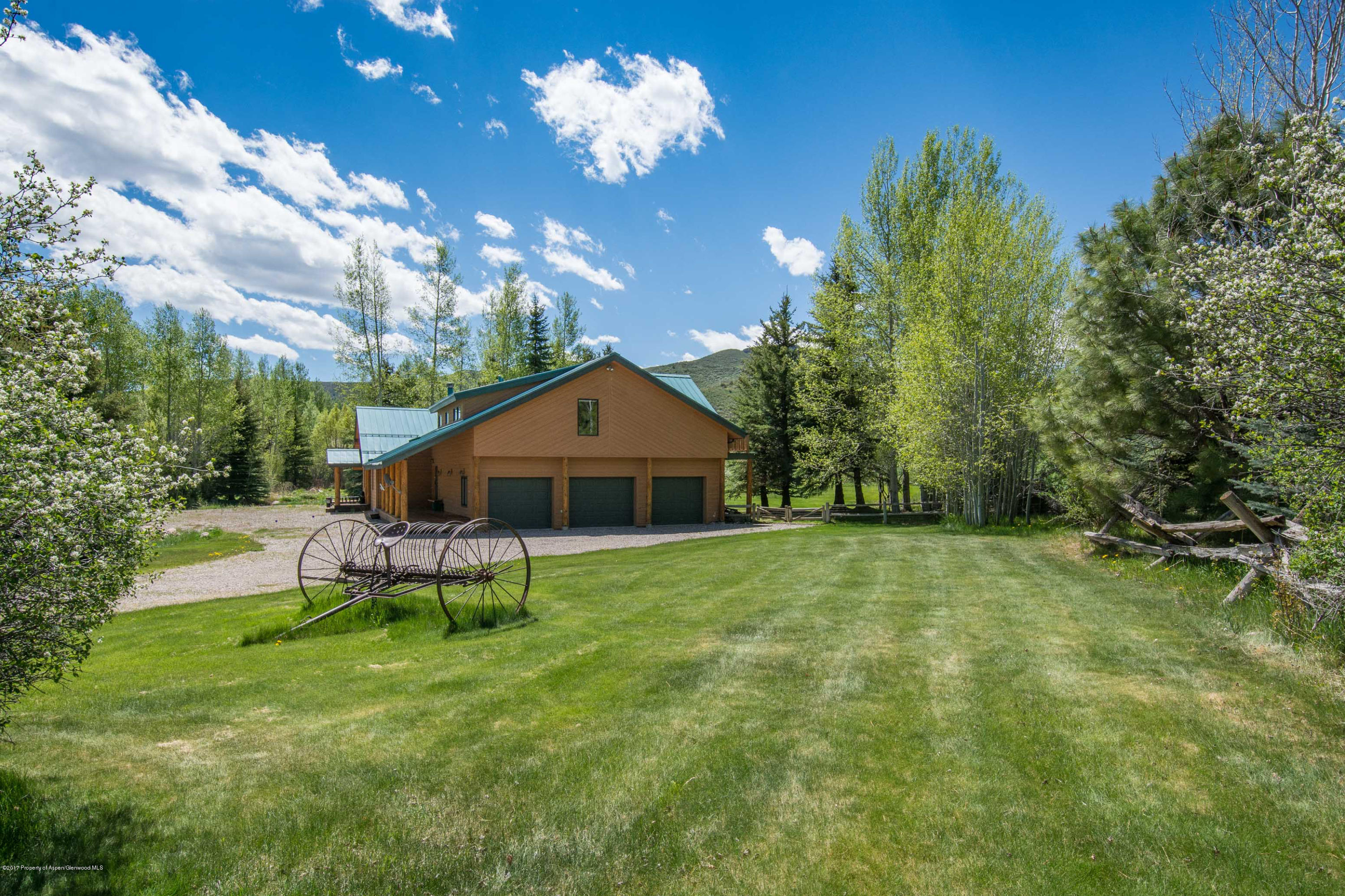 144 Haystack Lane Snowmass, CO 81654 - Photo 27 of 40 a view of a house with a yard and sitting area