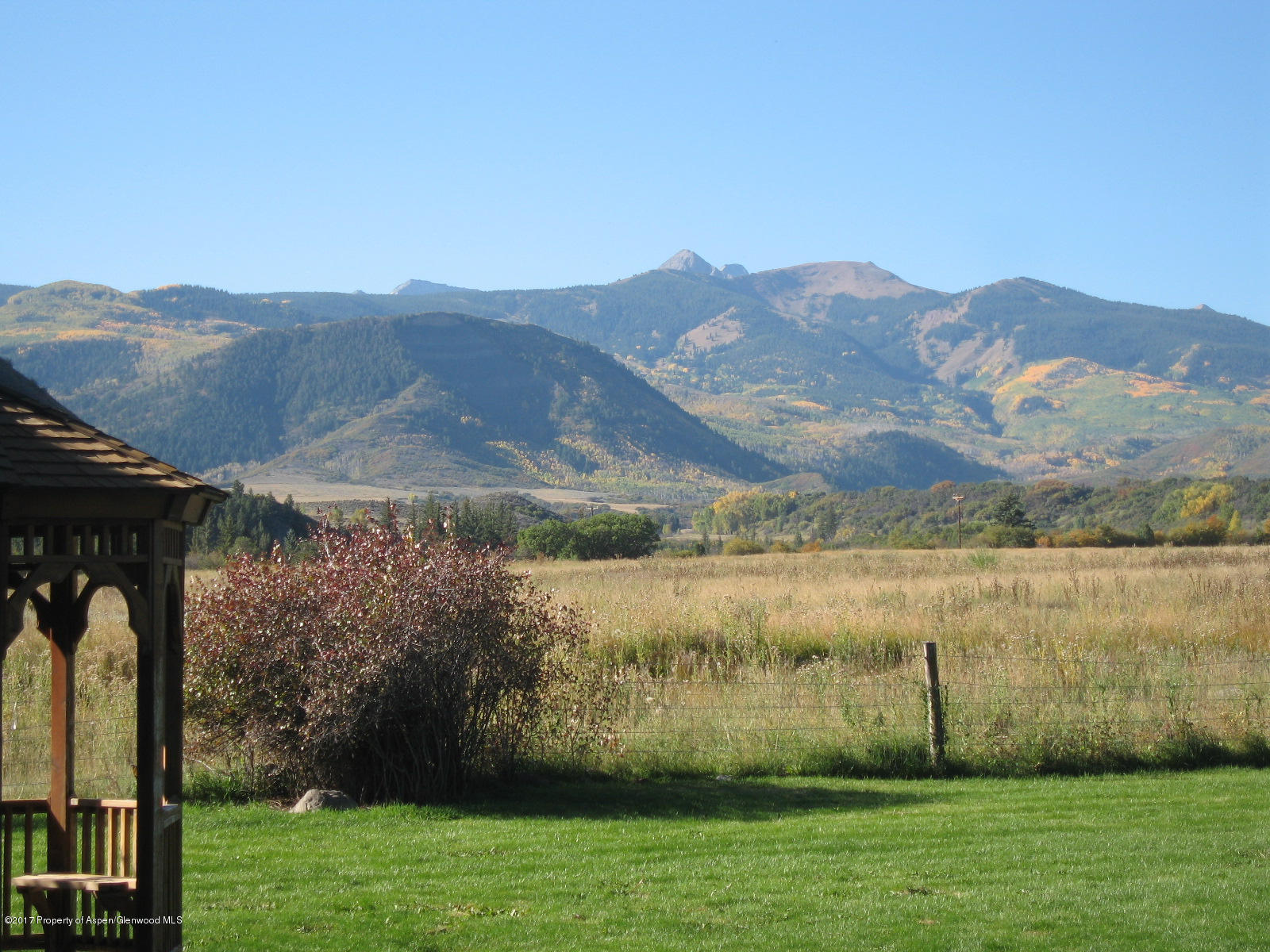 144 Haystack Lane Snowmass, CO 81654 - Photo 32 of 40 a view of a house with a yard
