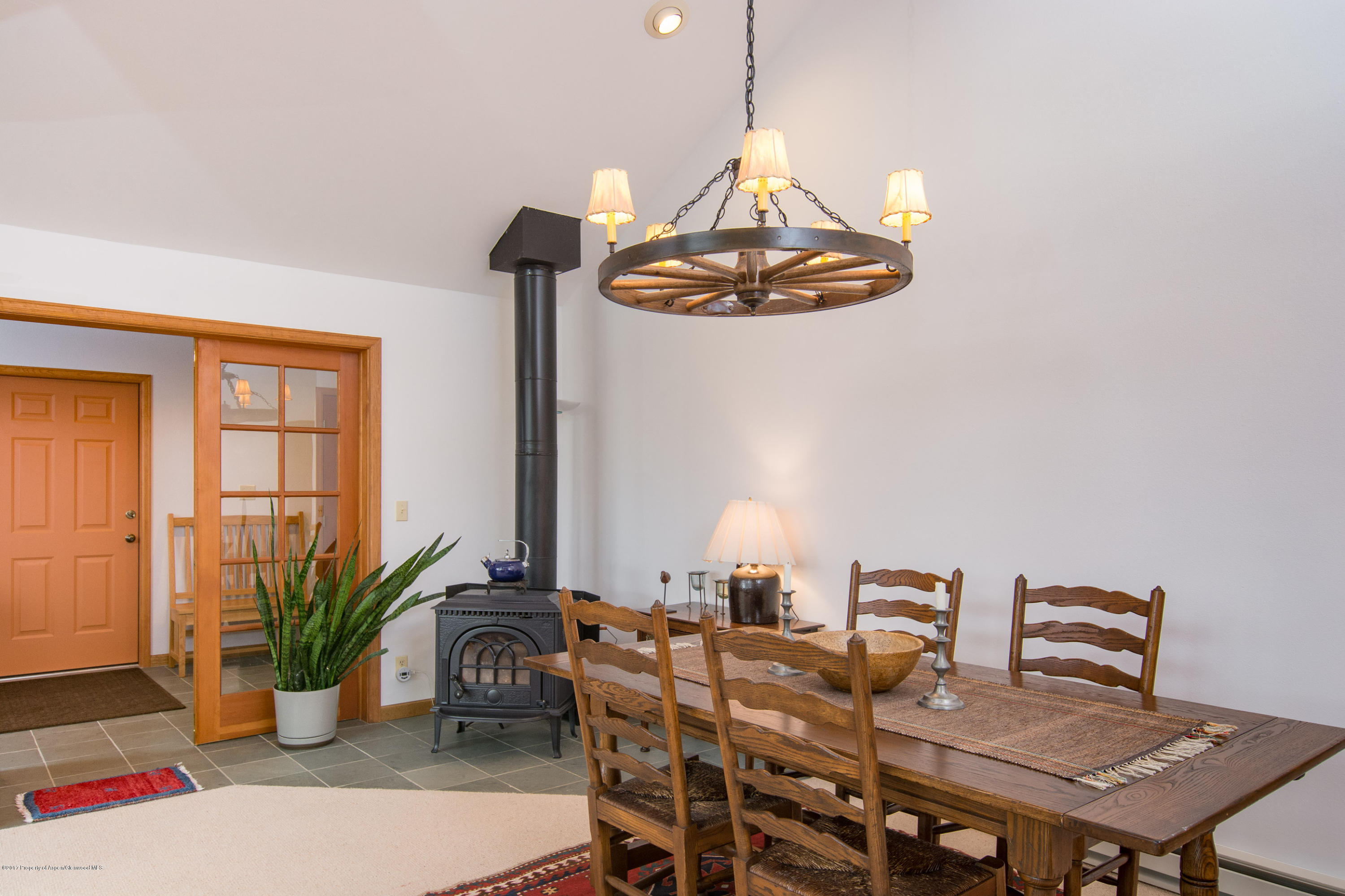 144 Haystack Lane Snowmass, CO 81654 - Photo 5 of 40 a view of a dining room with furniture window and wooden floor