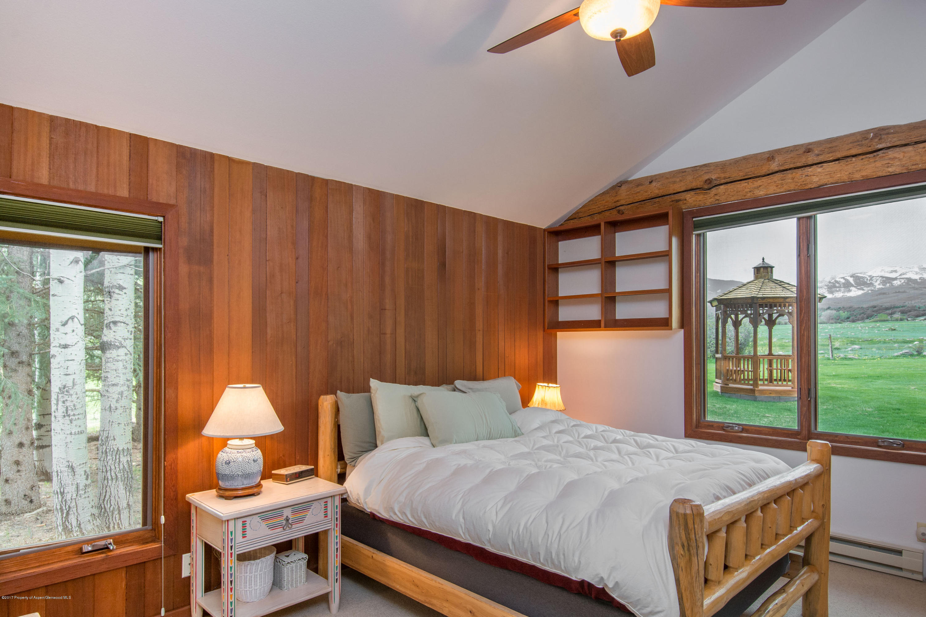 144 Haystack Lane Snowmass, CO 81654 - Photo 9 of 40 a bed room with a bed and a window