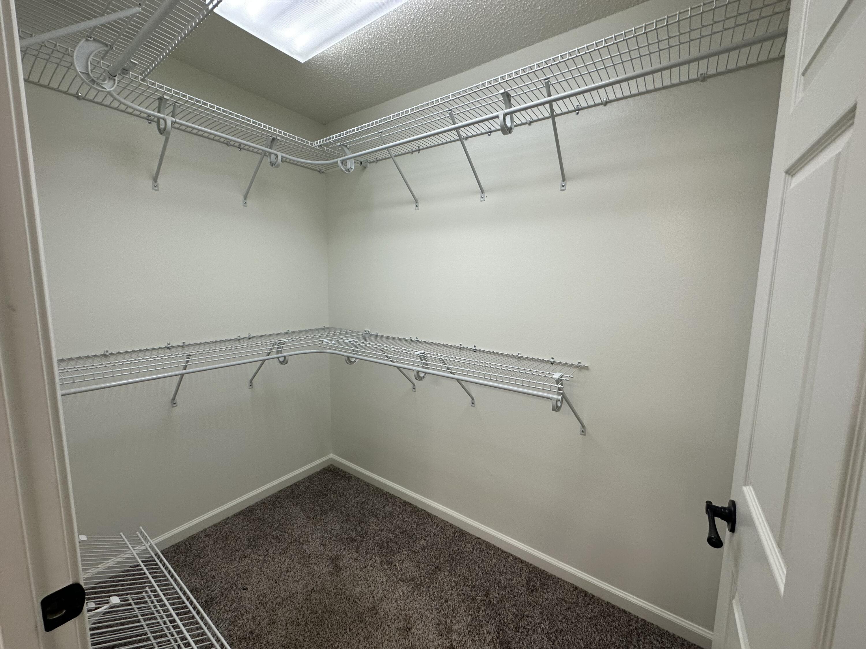 5570 Mt Olive Road Crestview, FL 32539 - Photo 11 of 34 a view of a room with racks on the wall