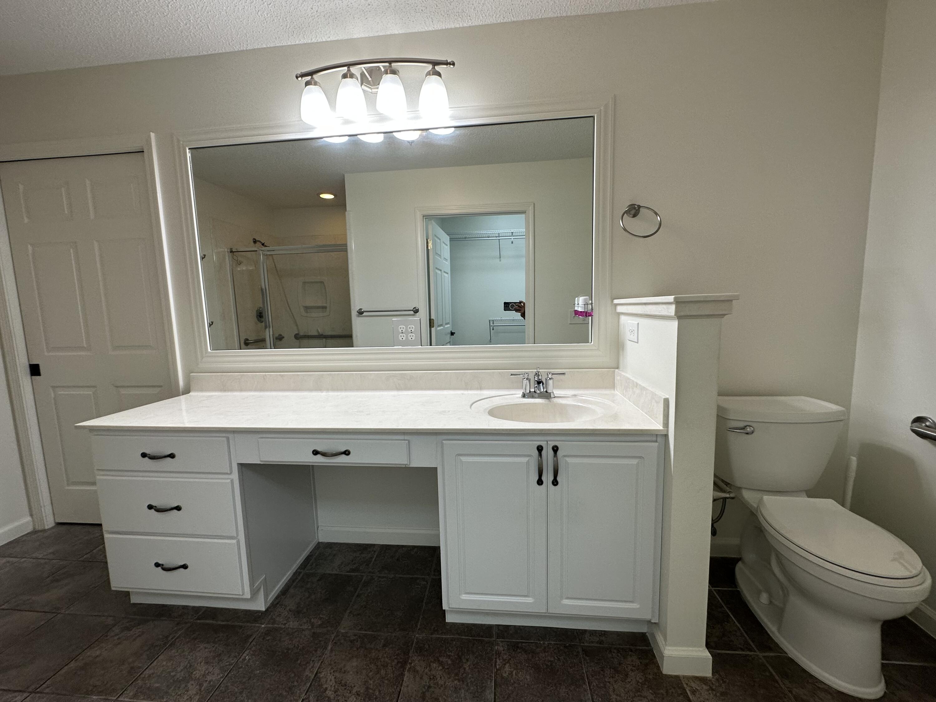 5570 Mt Olive Road Crestview, FL 32539 - Photo 12 of 34 a bathroom with a sink toilet and mirror