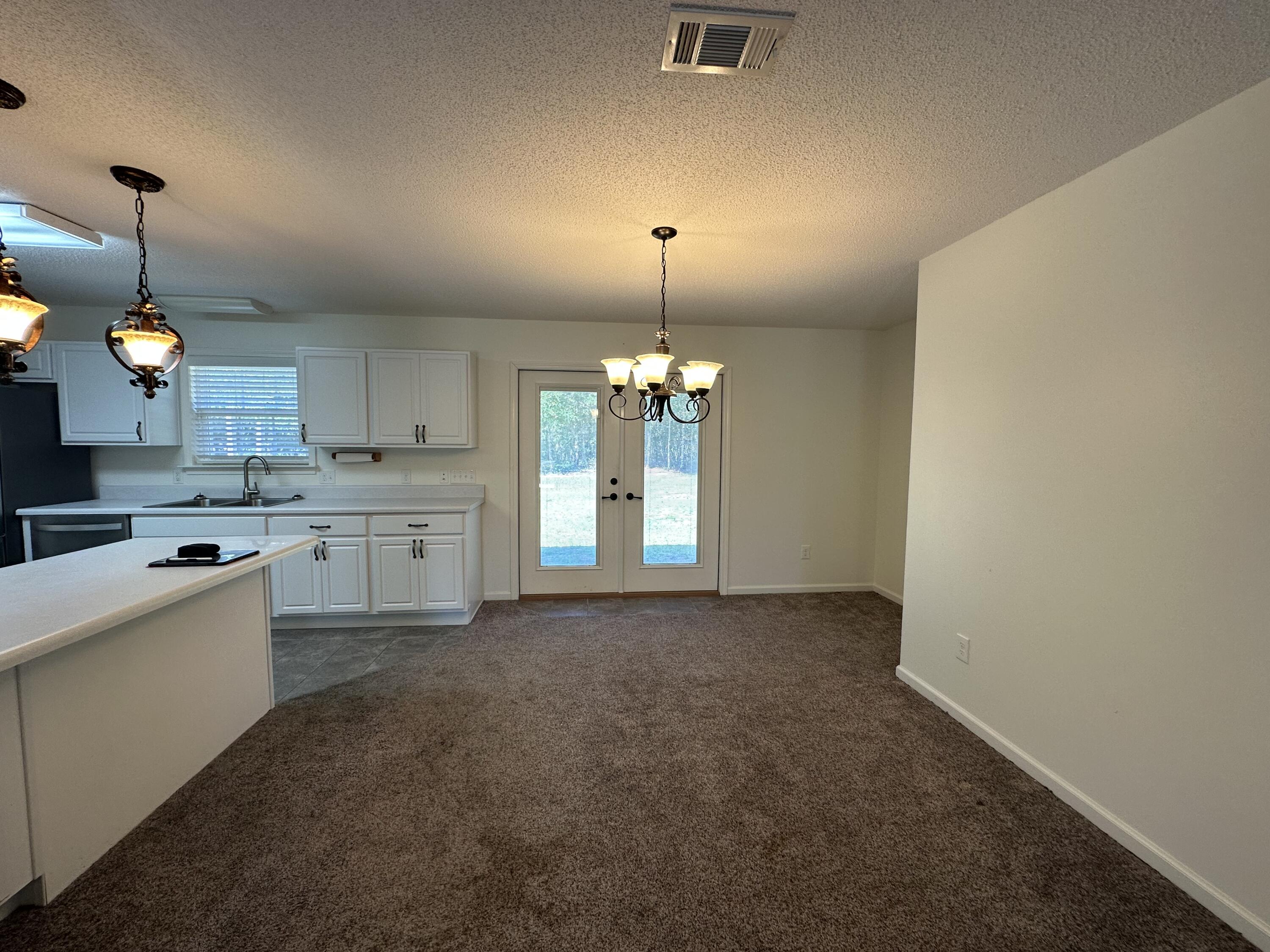 5570 Mt Olive Road Crestview, FL 32539 - Photo 16 of 34 a kitchen that has a lot of cabinets in it