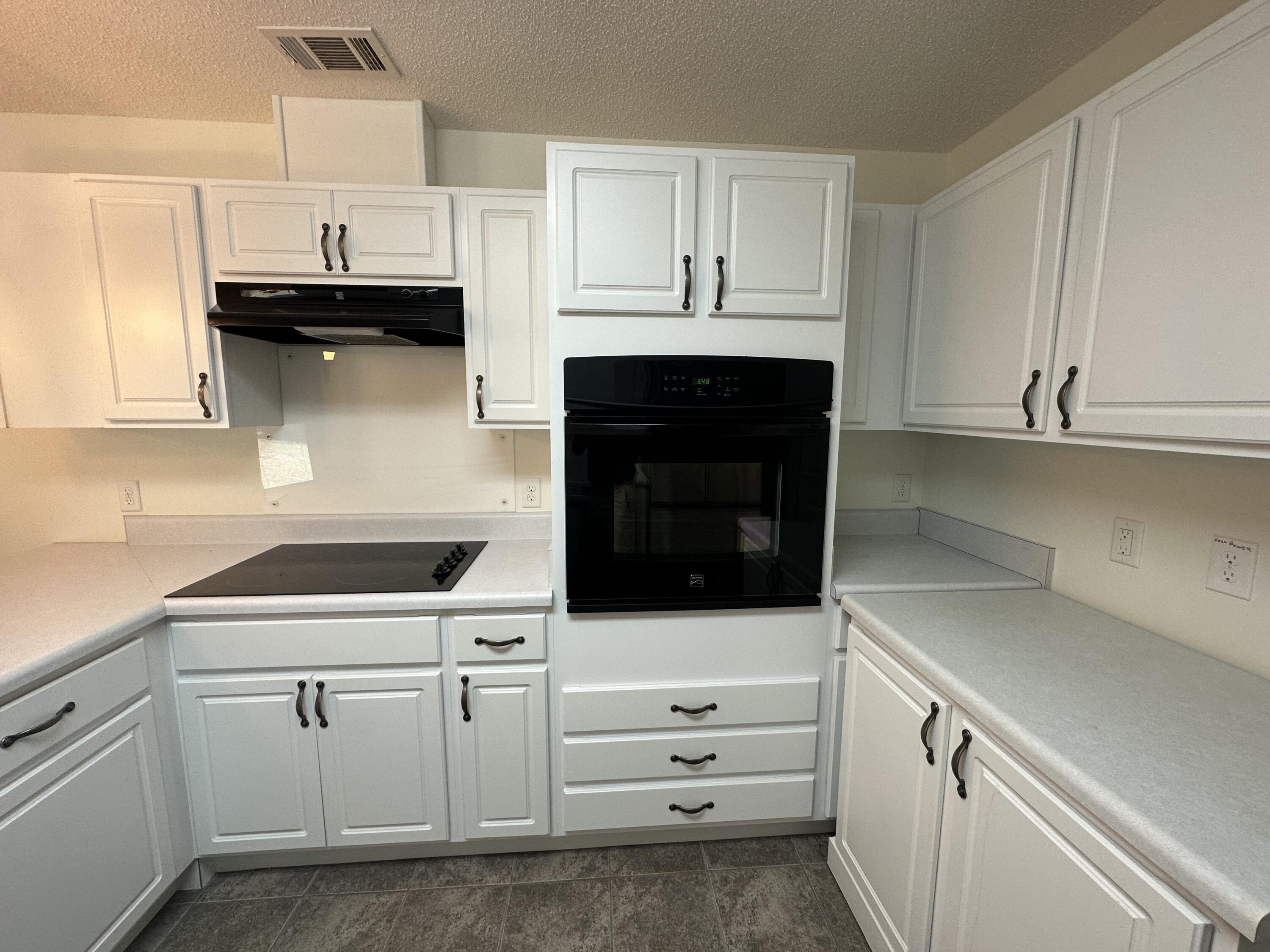 5570 Mt Olive Road Crestview, FL 32539 - Photo 19 of 34 a kitchen with white cabinets and sink