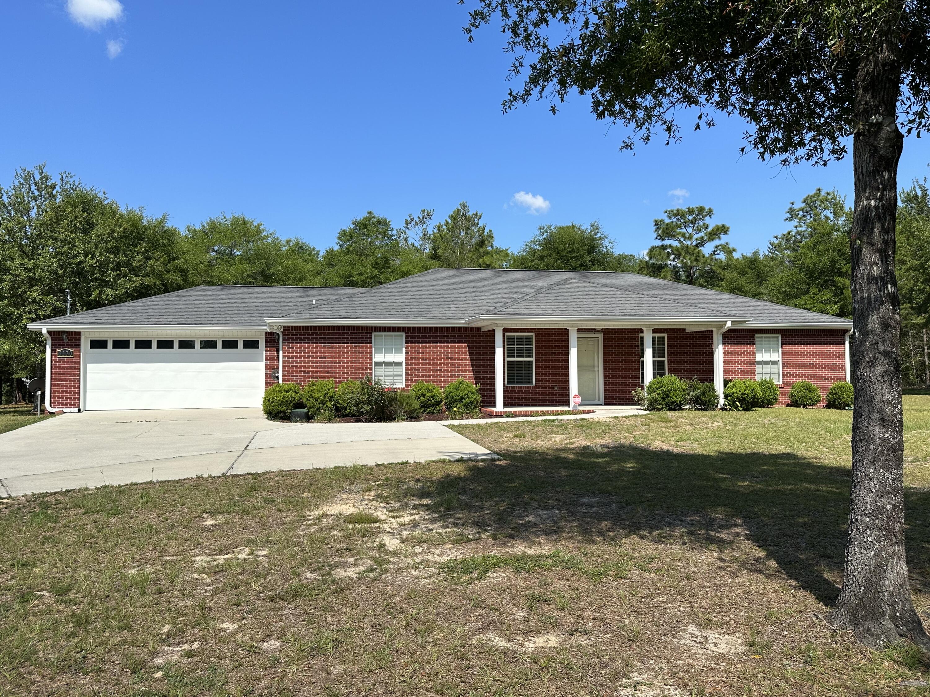 5570 Mt Olive Road Crestview, FL 32539 - Photo 2 of 34 a view of a yard in front of a house with a yard