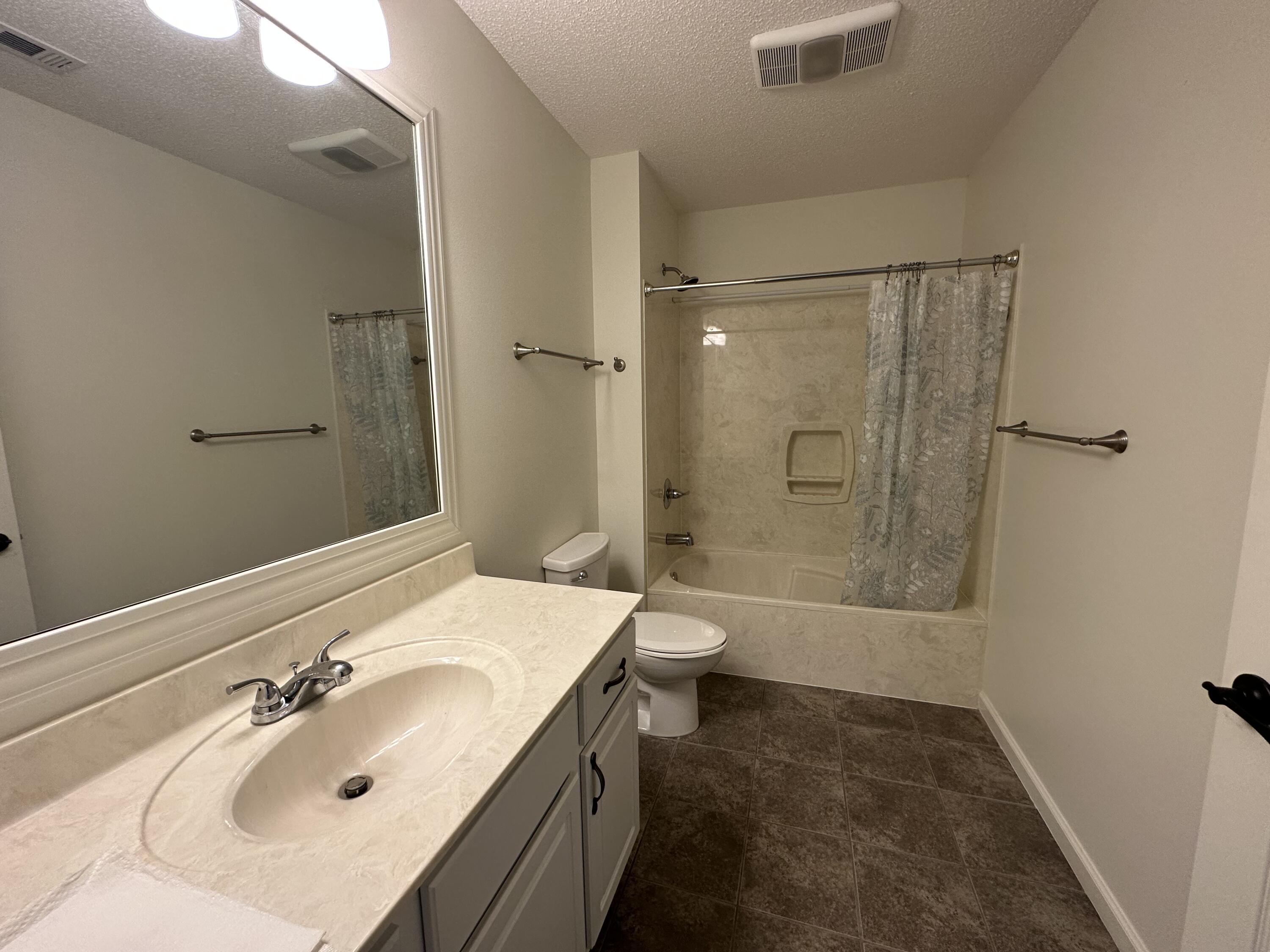 5570 Mt Olive Road Crestview, FL 32539 - Photo 21 of 34 a bathroom with a sink a toilet and shower