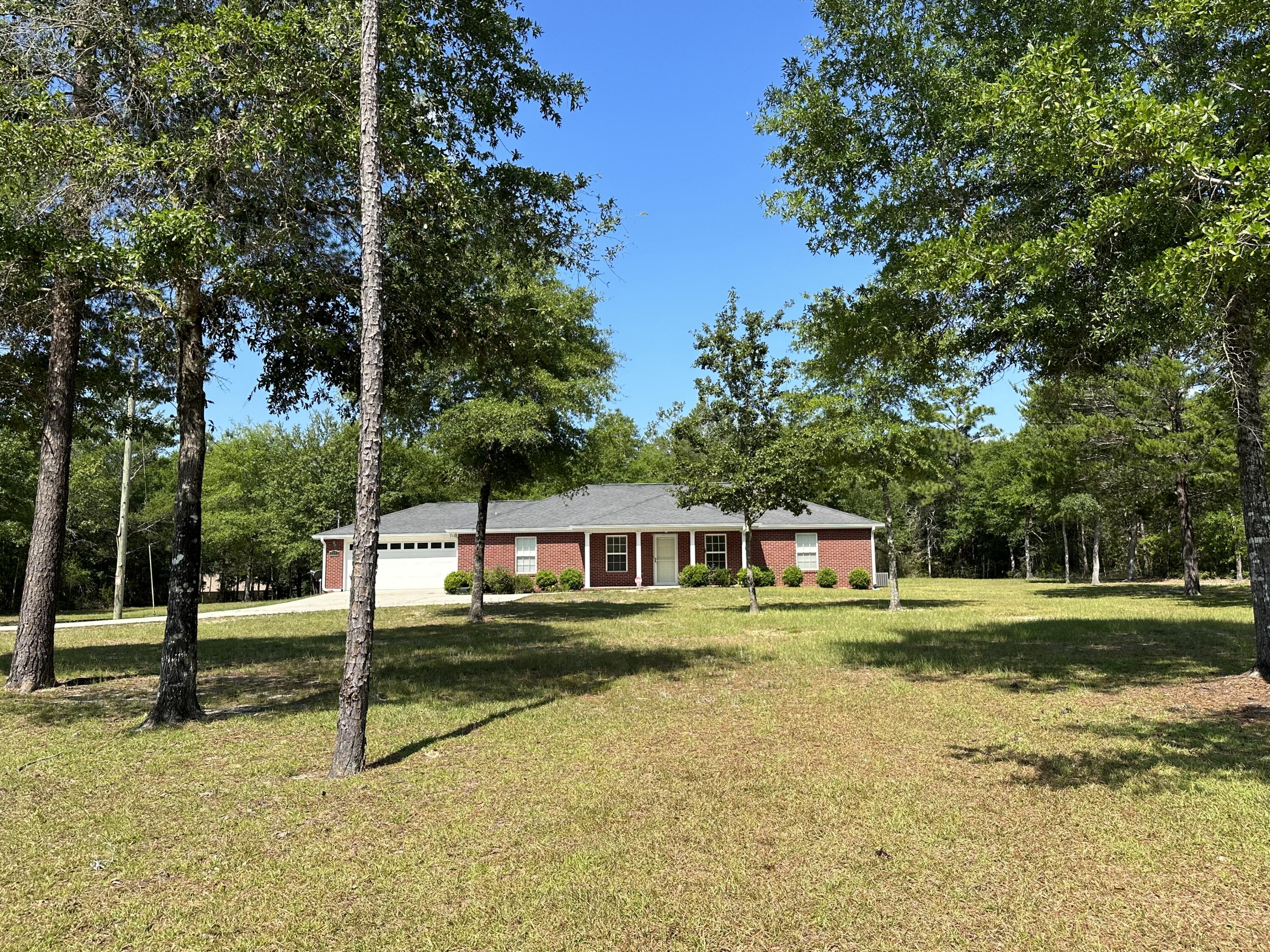 5570 Mt Olive Road Crestview, FL 32539 - Photo 26 of 34 a view of a house with a yard and sitting area