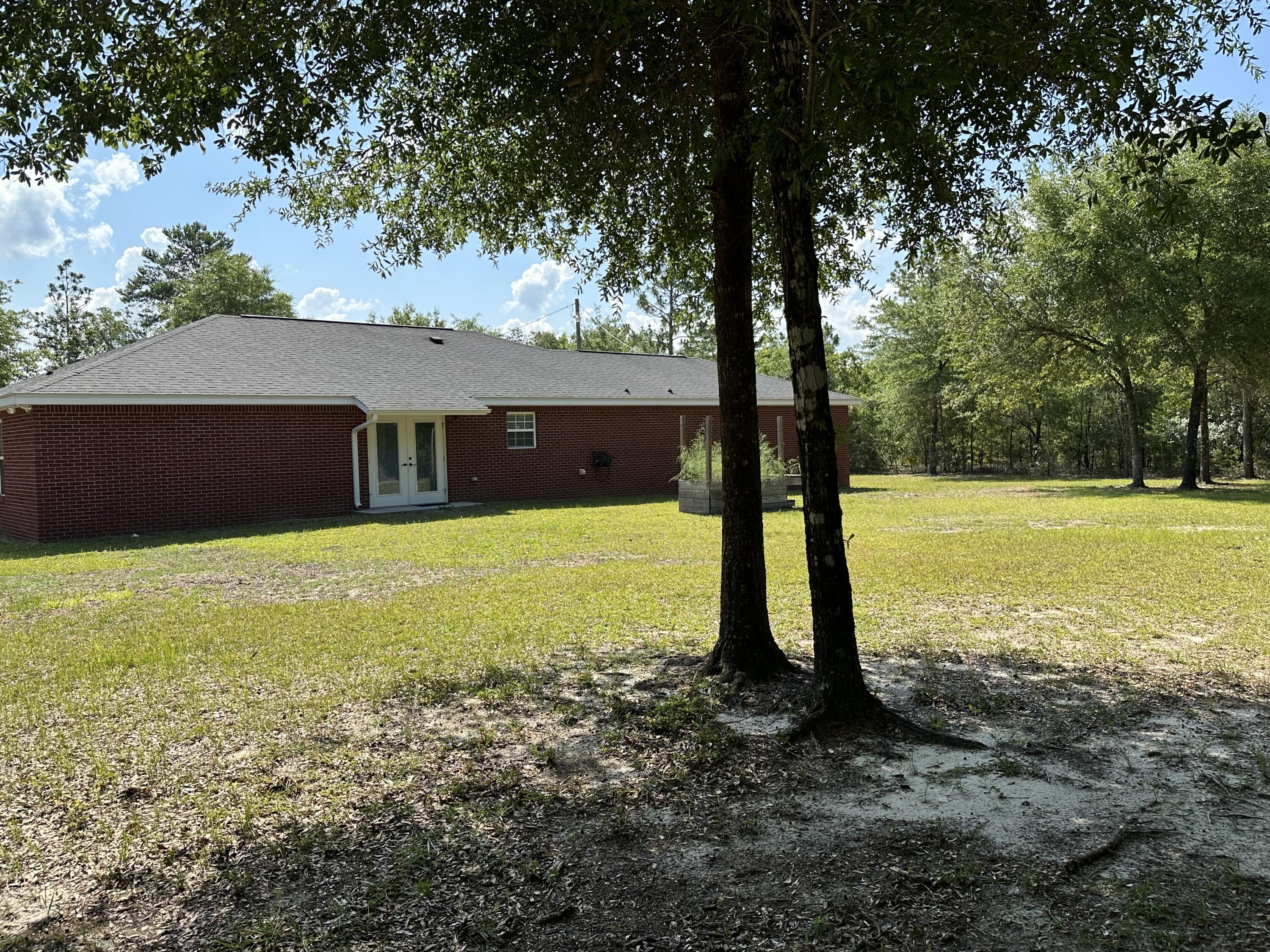 5570 Mt Olive Road Crestview, FL 32539 - Photo 27 of 34 a view of a house with a yard