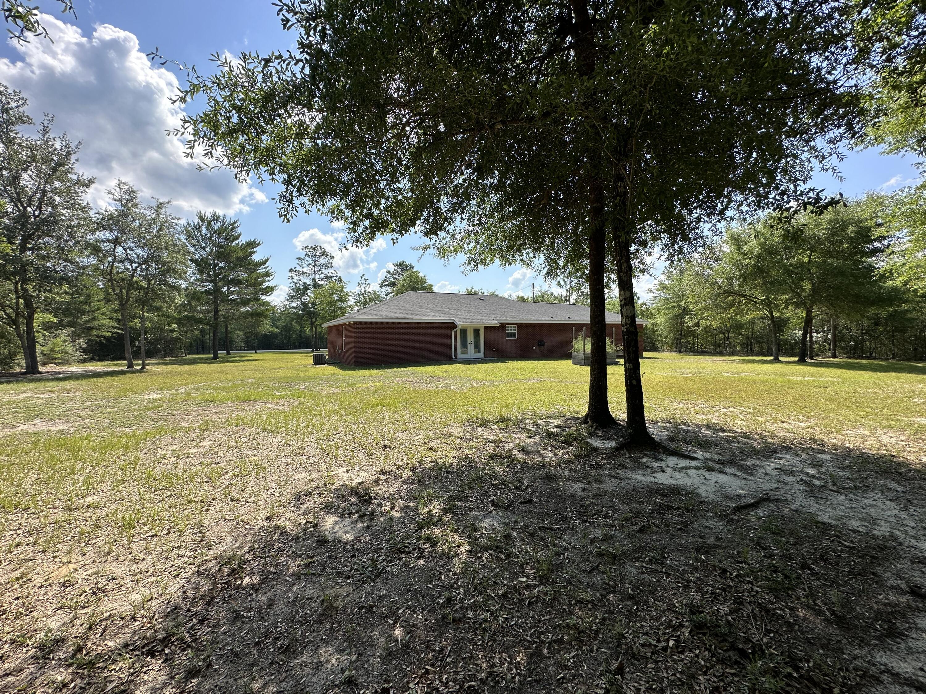 5570 Mt Olive Road Crestview, FL 32539 - Photo 28 of 34 a view of a field with a tree