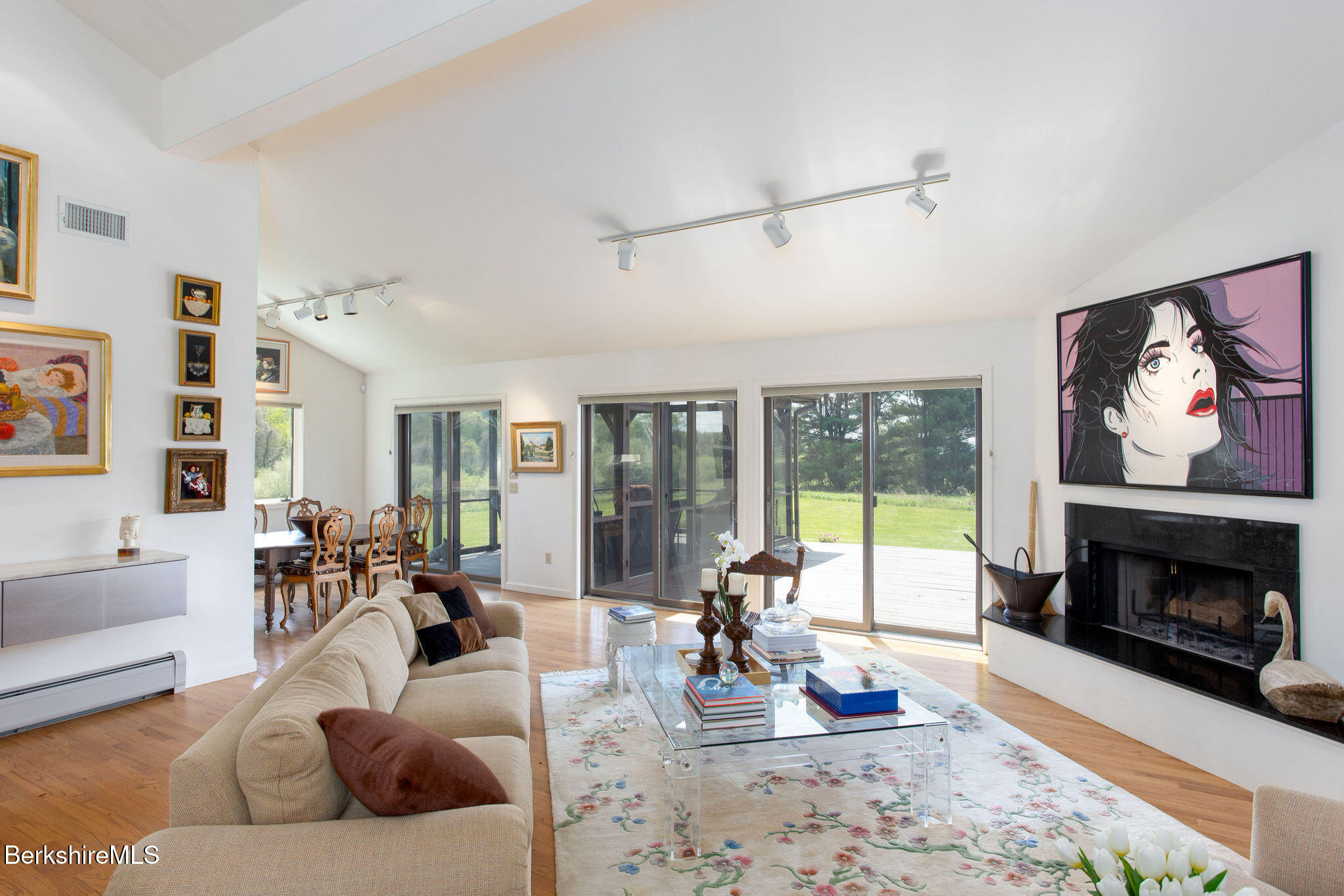 77 Hurlburt Road Great Barrington, MA 01230 - Photo 18 of 48 a living room with furniture large window and a fireplace