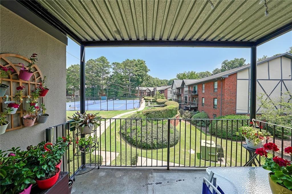 6851 Roswell Road, Unit O3 Atlanta, GA 30328 - Photo 21 of 30 a view of a house with a flower garden