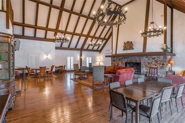 a dining room with furniture a chandelier