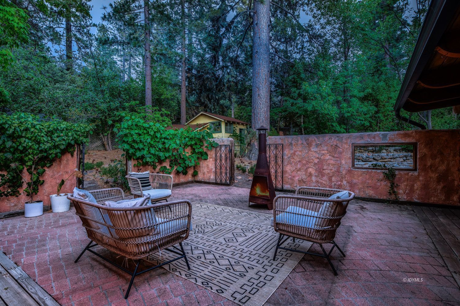 53155 Tollgate Road Idyllwild, CA 92549 - Photo 29 of 47 a backyard of a house with outdoor seating