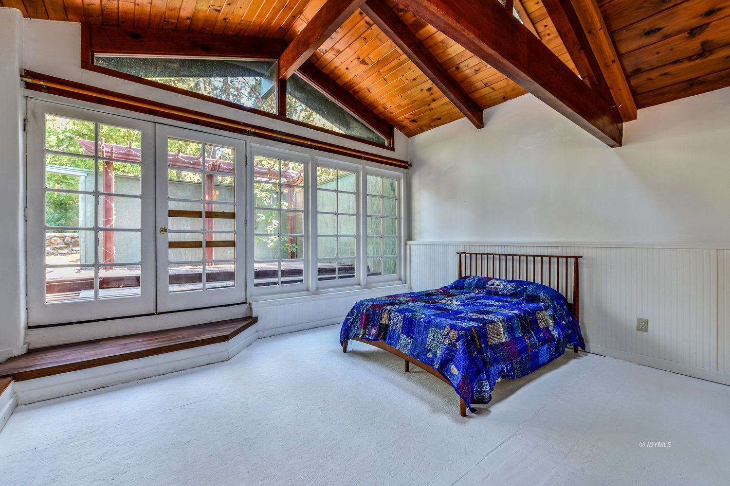 53155 Tollgate Road Idyllwild, CA 92549 - Photo 42 of 47 a spacious bedroom with a bed and a large window