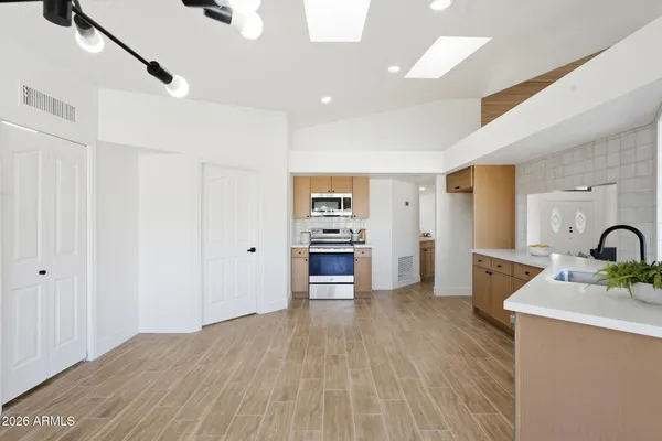 a view of a dining room with furniture and wooden floor