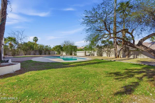 a view of a garden with a fountain