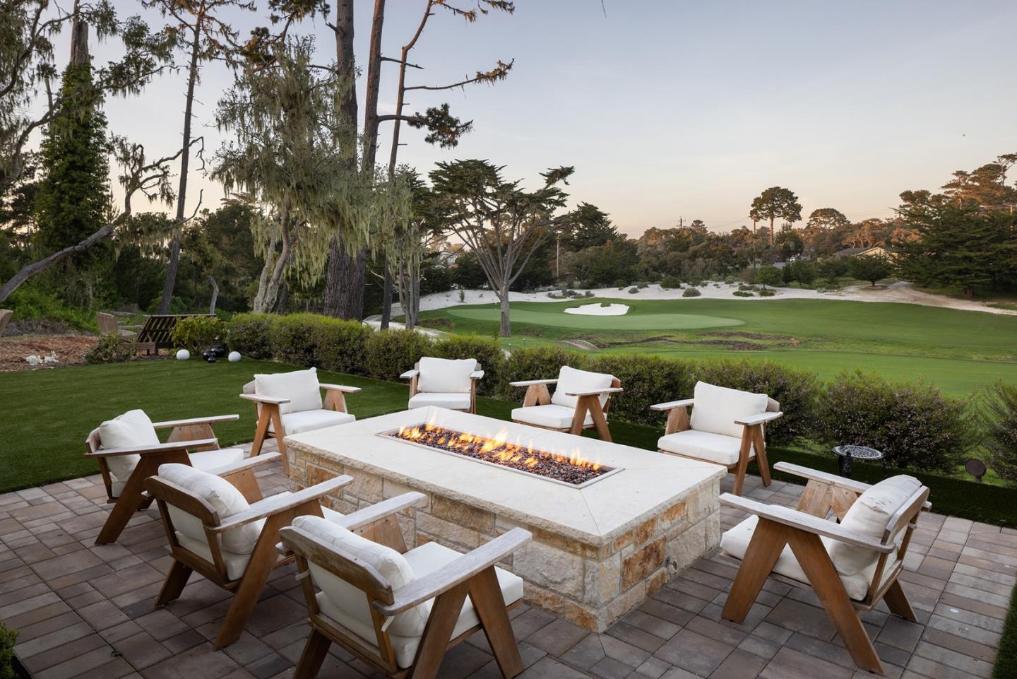 2931 Sloat Road Pebble Beach, CA 93953 - Photo 15 of 34 a wooden bench sitting in the middle of a park