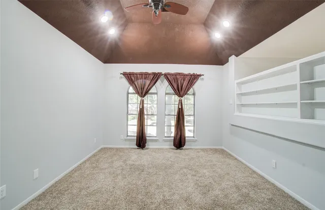 a bathroom with a granite countertop tub shower and sink