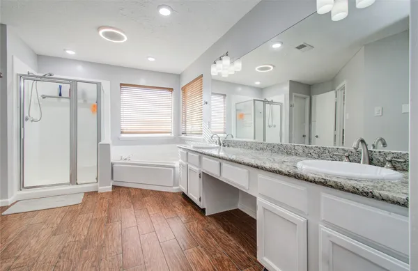 a large bathroom with a granite countertop sink mirror and