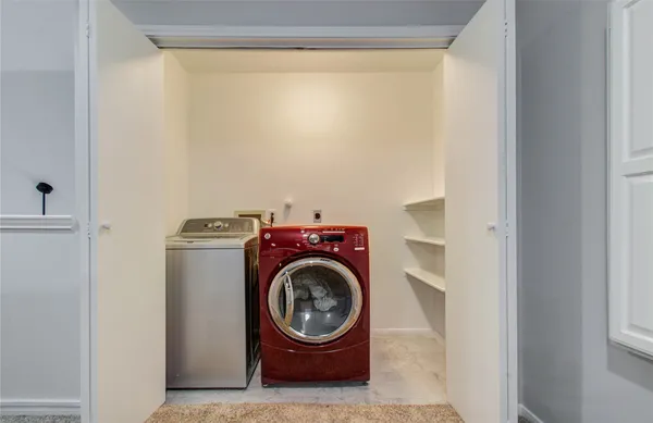 a view of washer and dryer in a utility room