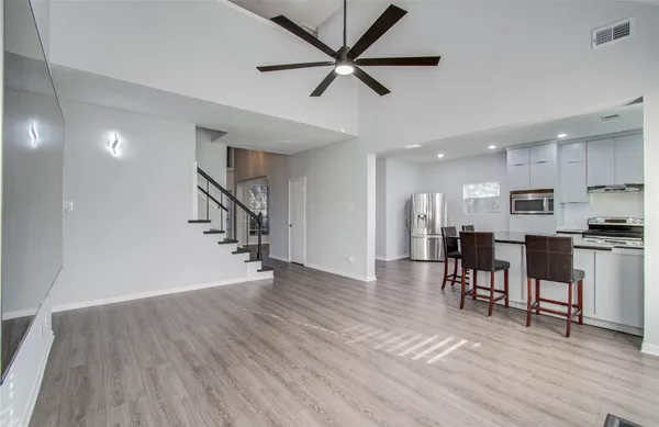a view of kitchen with cabinets and wooden floor