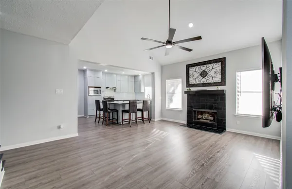 a view of a livingroom with furniture and a fireplace