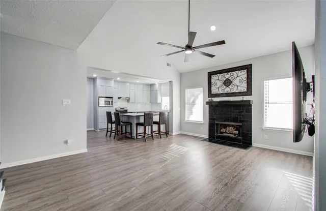 a view of a livingroom with furniture and a fireplace