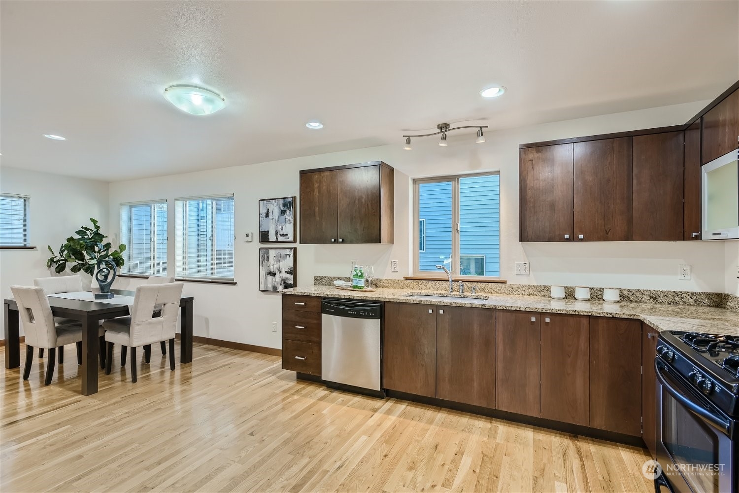 5935 California Avenue Southwest Seattle, WA 98136 - Photo 11 of 32 a kitchen with lots of counter top space and dining table