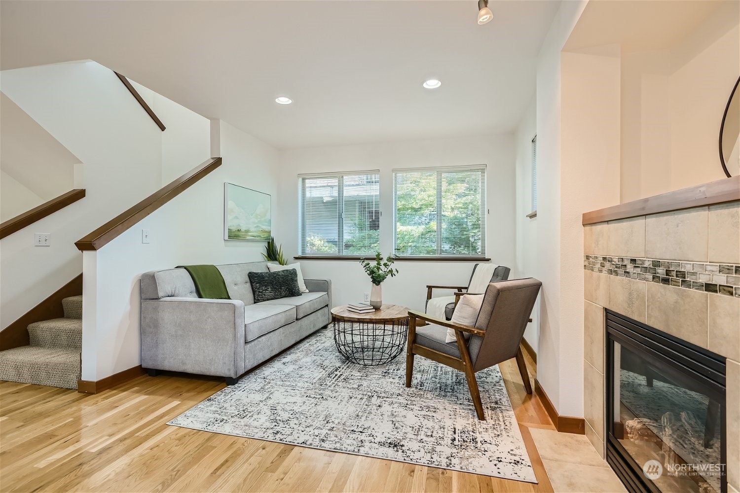 5935 California Avenue Southwest Seattle, WA 98136 - Photo 16 of 32 a living room with furniture and a fireplace