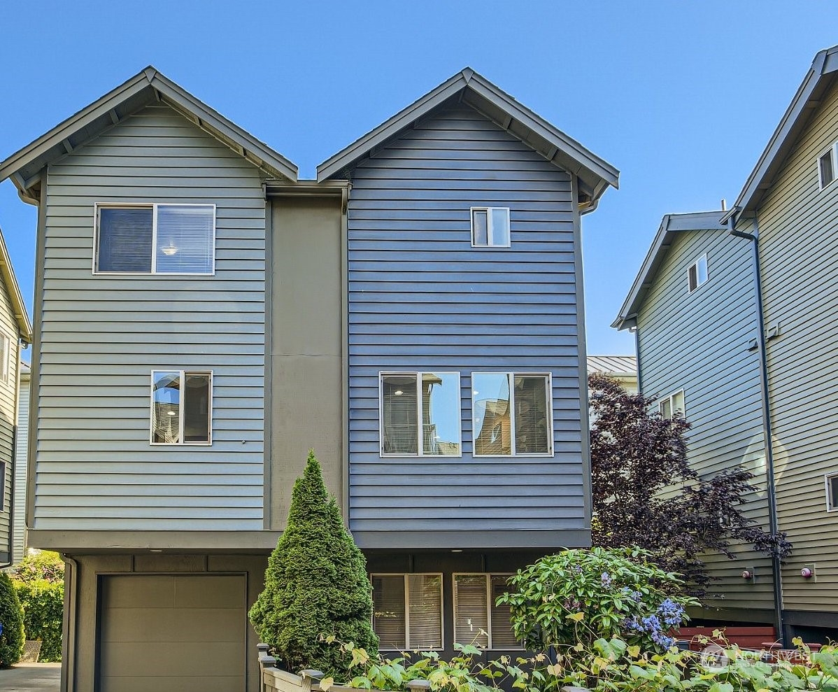 5935 California Avenue Southwest Seattle, WA 98136 - Photo 2 of 32 a front view of a house with a garden