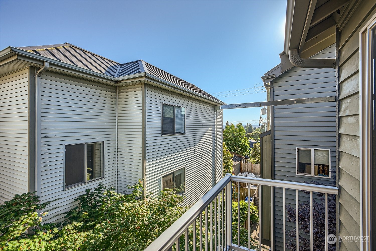 5935 California Avenue Southwest Seattle, WA 98136 - Photo 21 of 32 a view of a house with a yard and potted plants