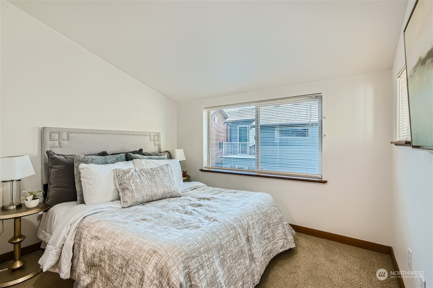 5935 California Avenue Southwest Seattle, WA 98136 - Photo 26 of 32 a bedroom with a bed and a window