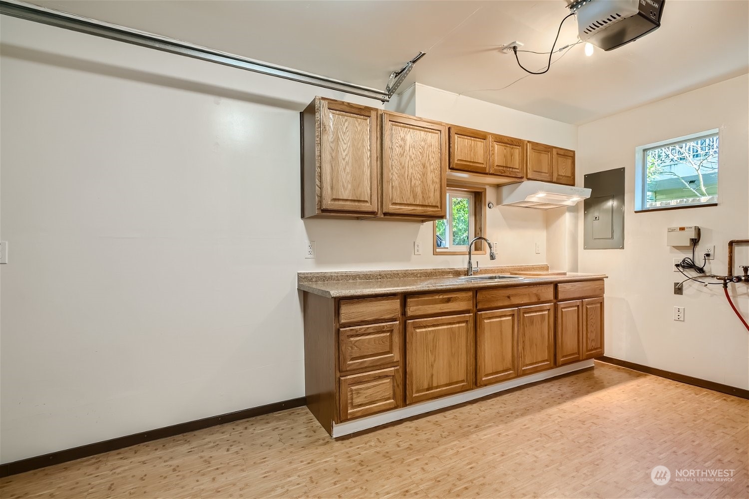 5935 California Avenue Southwest Seattle, WA 98136 - Photo 29 of 32 a kitchen with a sink cabinets and window