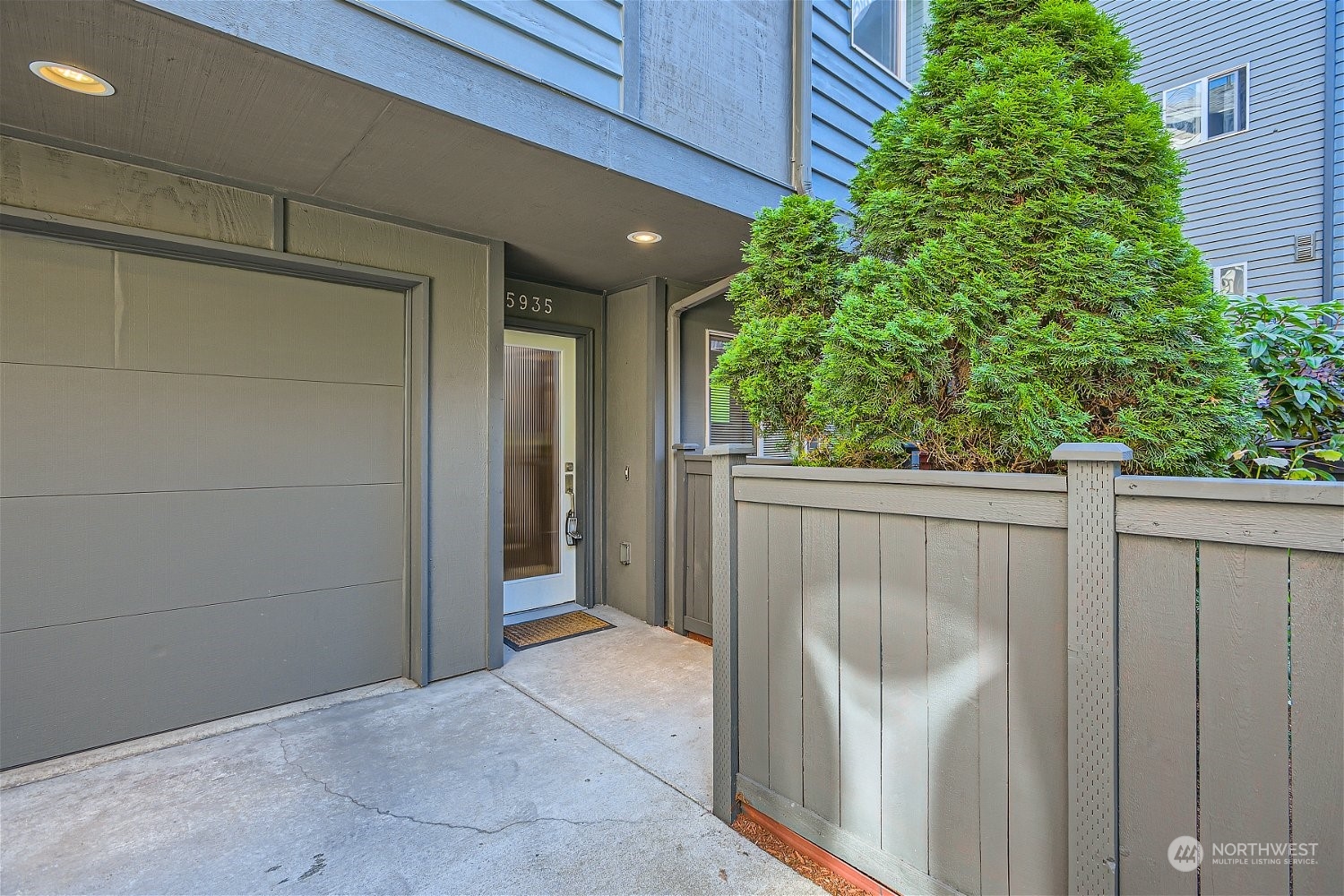 5935 California Avenue Southwest Seattle, WA 98136 - Photo 3 of 32 a view of a door and wooden fence