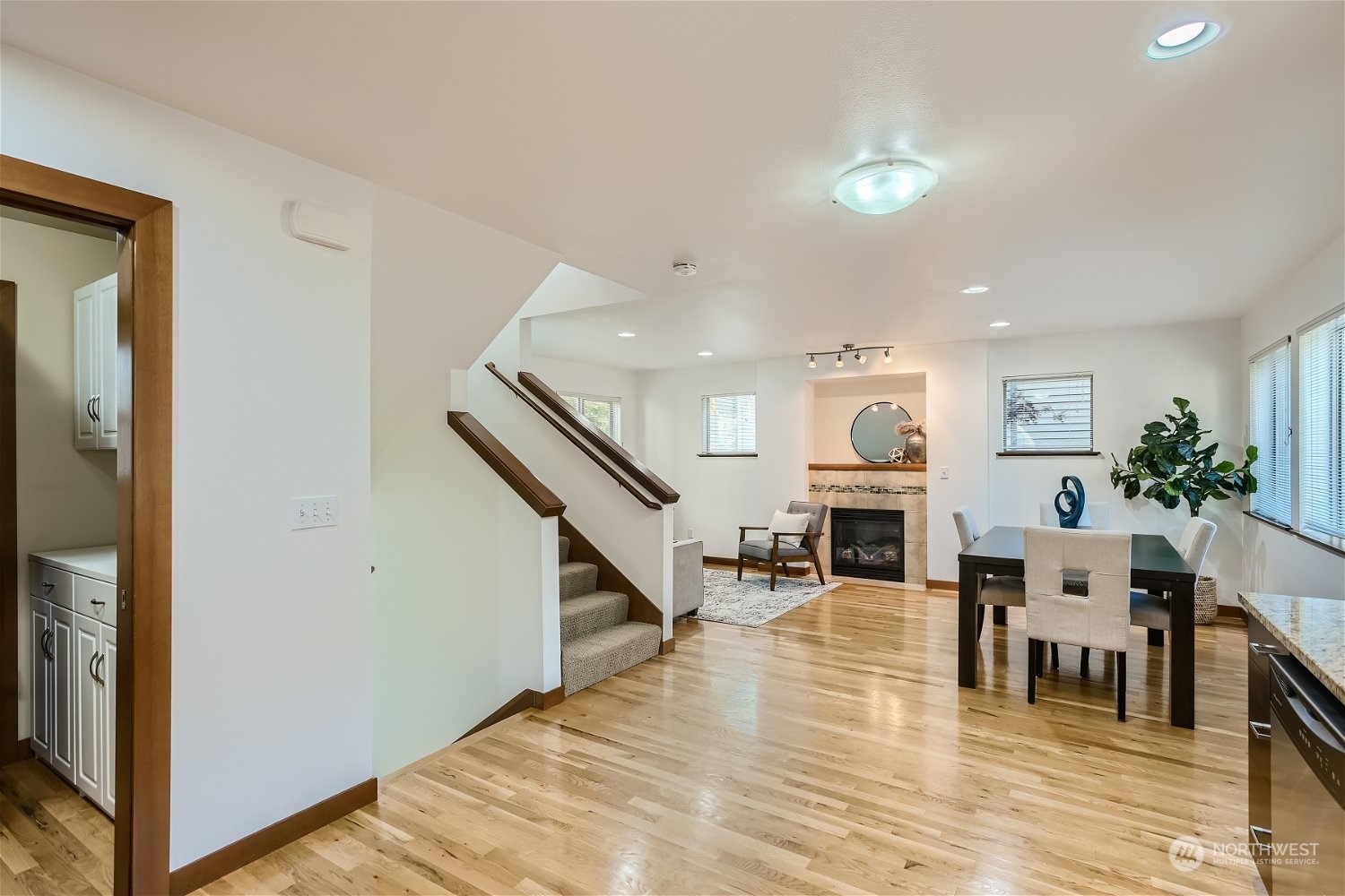 5935 California Avenue Southwest Seattle, WA 98136 - Photo 10 of 32 a view of dining room with furniture and fireplace